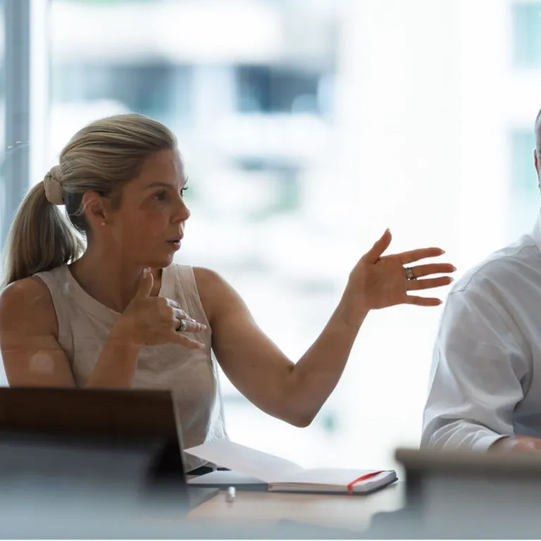 Woman speaking during meeting