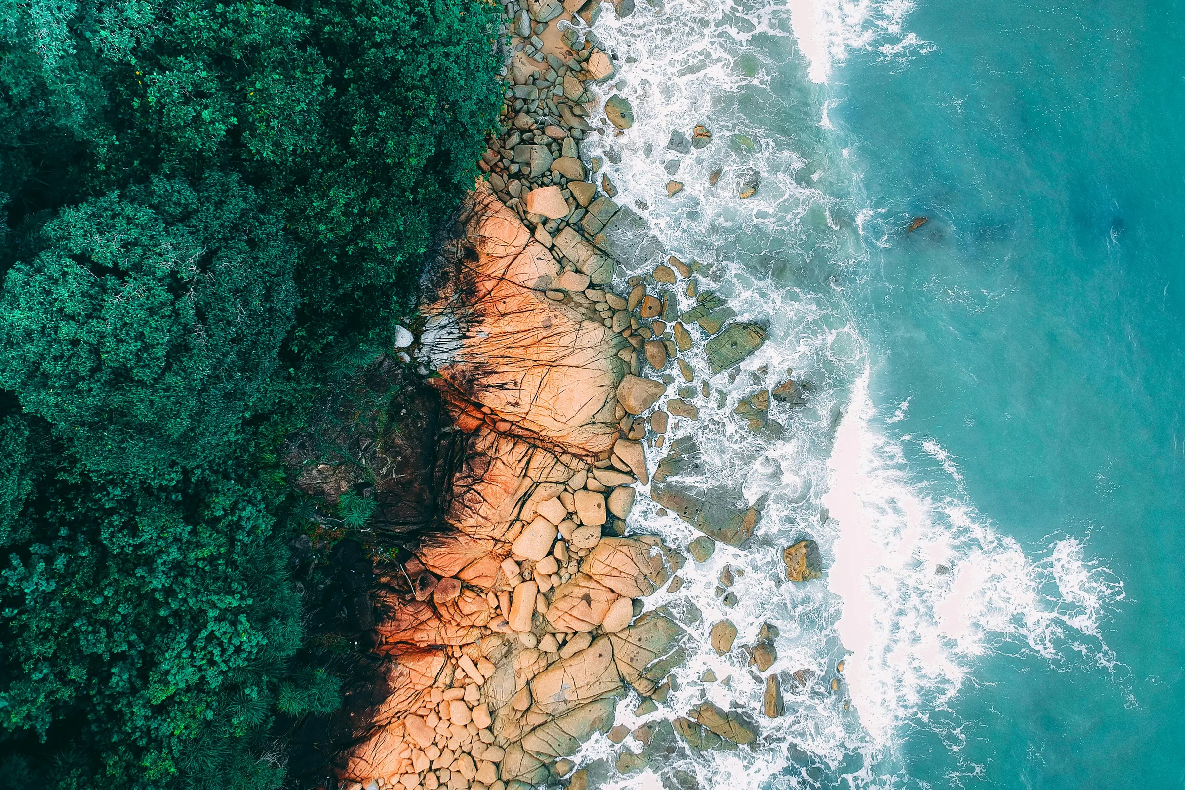 Overhead shot of rocks meeting ocean