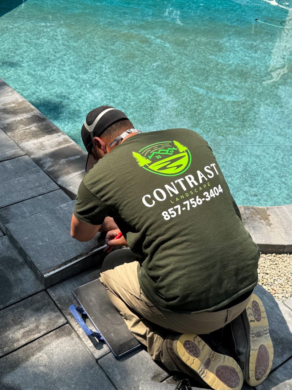 Contrast Landscape founder Henrique Almeida and crew on a hardscaping project site in southeastern Massachusetts