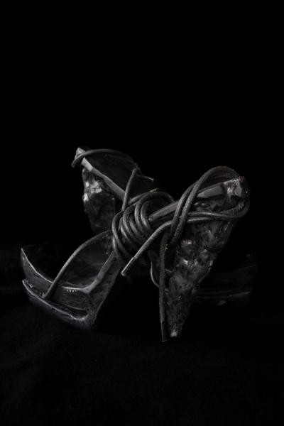 Hot woman in hight heels. Avant garde fashion. Haute de couture. Tribal postapocaliptic fashion. Foot fetish