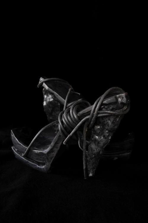 Hot woman in hight heels. Avant garde fashion. Haute de couture. Tribal postapocaliptic fashion. Foot fetish