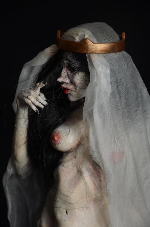 kristina makarova from playboy ukraine isnpired this fine arts sculpture with a religious gothic art undertone, reminding of afrench Madonna in veil and cape, also known as the Virgin Mary, made a real sensual woman with feelings of angst, ballerina gracious feet in her middle age, the fruit of life itself.