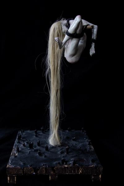 A small candle of hair and flesh