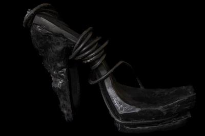 Hot woman in hight heels. Avant garde fashion. Haute de couture. Tribal postapocaliptic fashion. Foot fetish