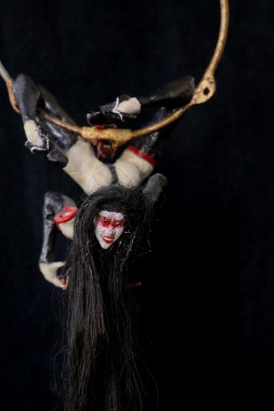 a twisted muse with a mischevious smile