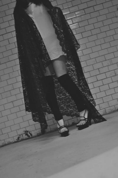 Virginal maiden with leg warmers and high heels