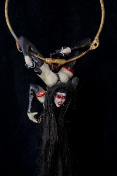 a twisted muse with a mischevious smile