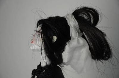 Beauiful woman with messy hair and a ribbon in her hair