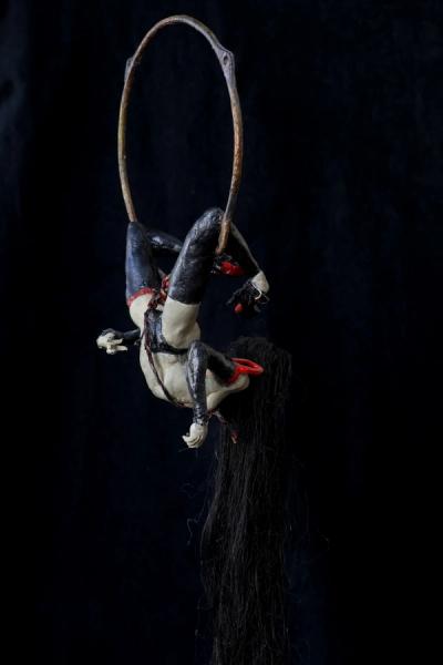 a twisted muse with a mischevious smile