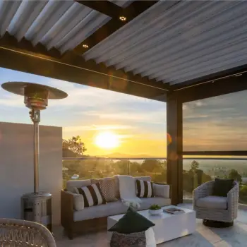 Recessed puck lighting in a metal louvered pergola