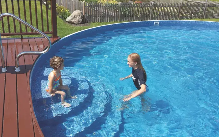 Radient Metric Pool with Steps and Wood Deck