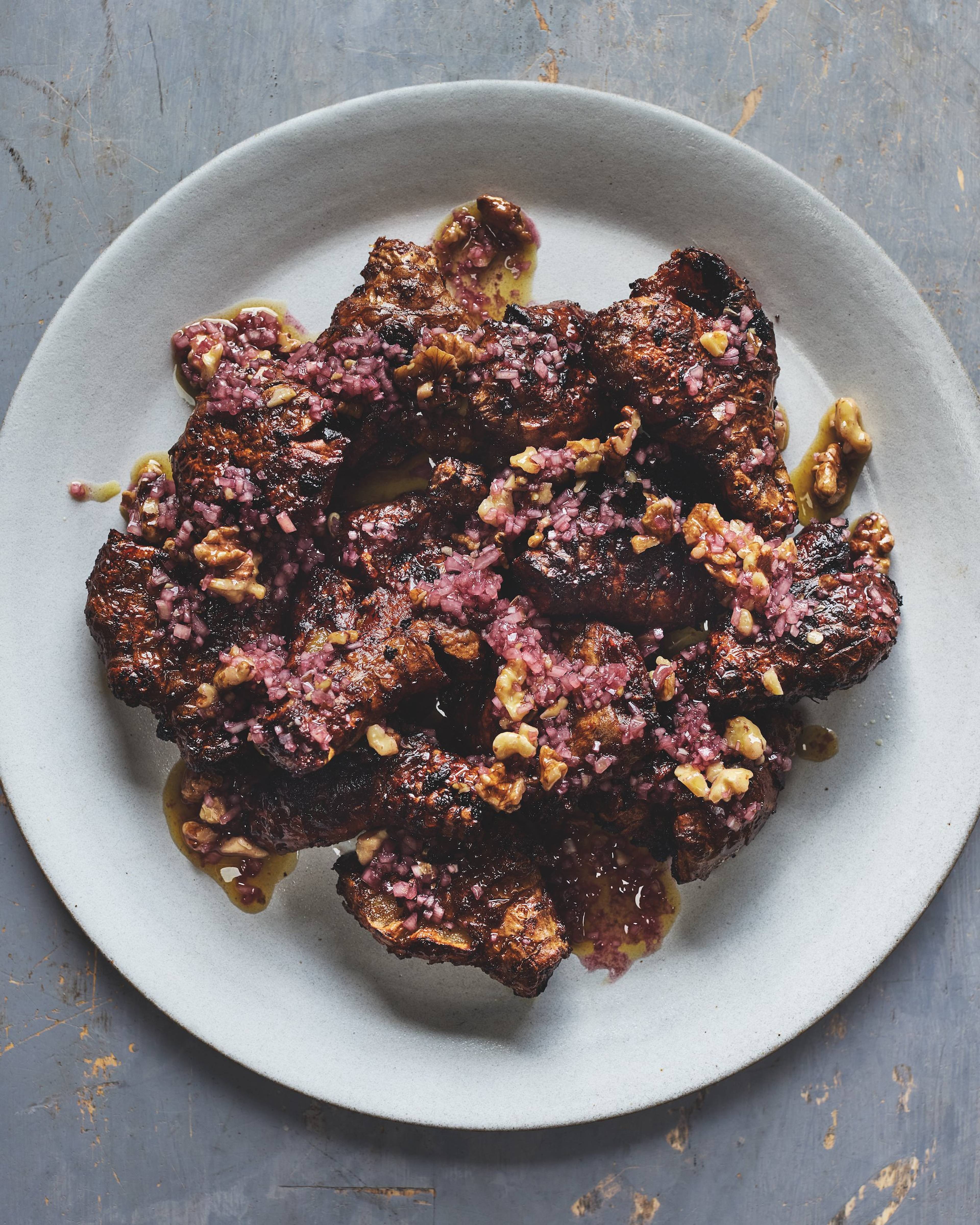 crispy jerusalem artichokes on a white plate