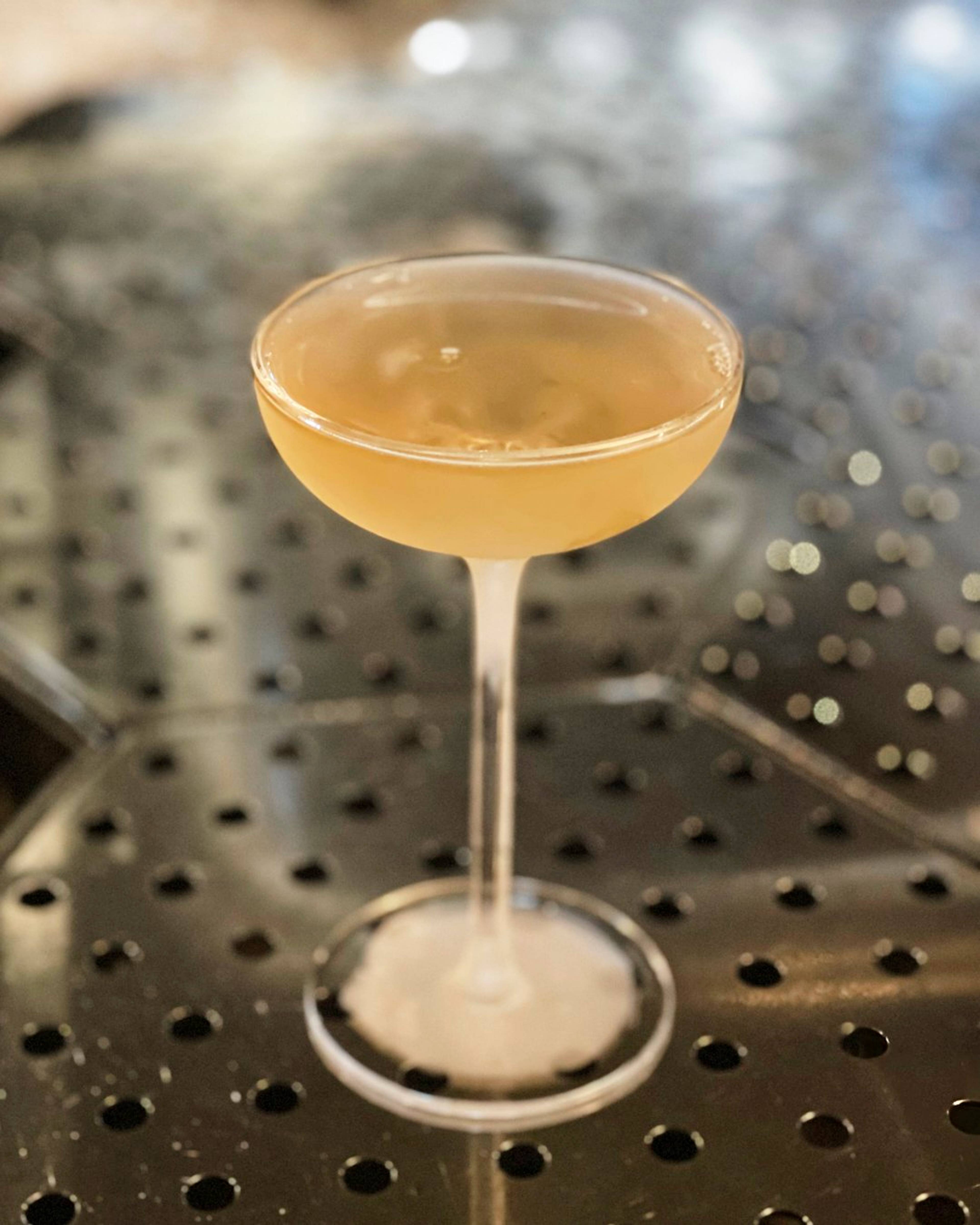 Mango cocktail served in a cocktail flute