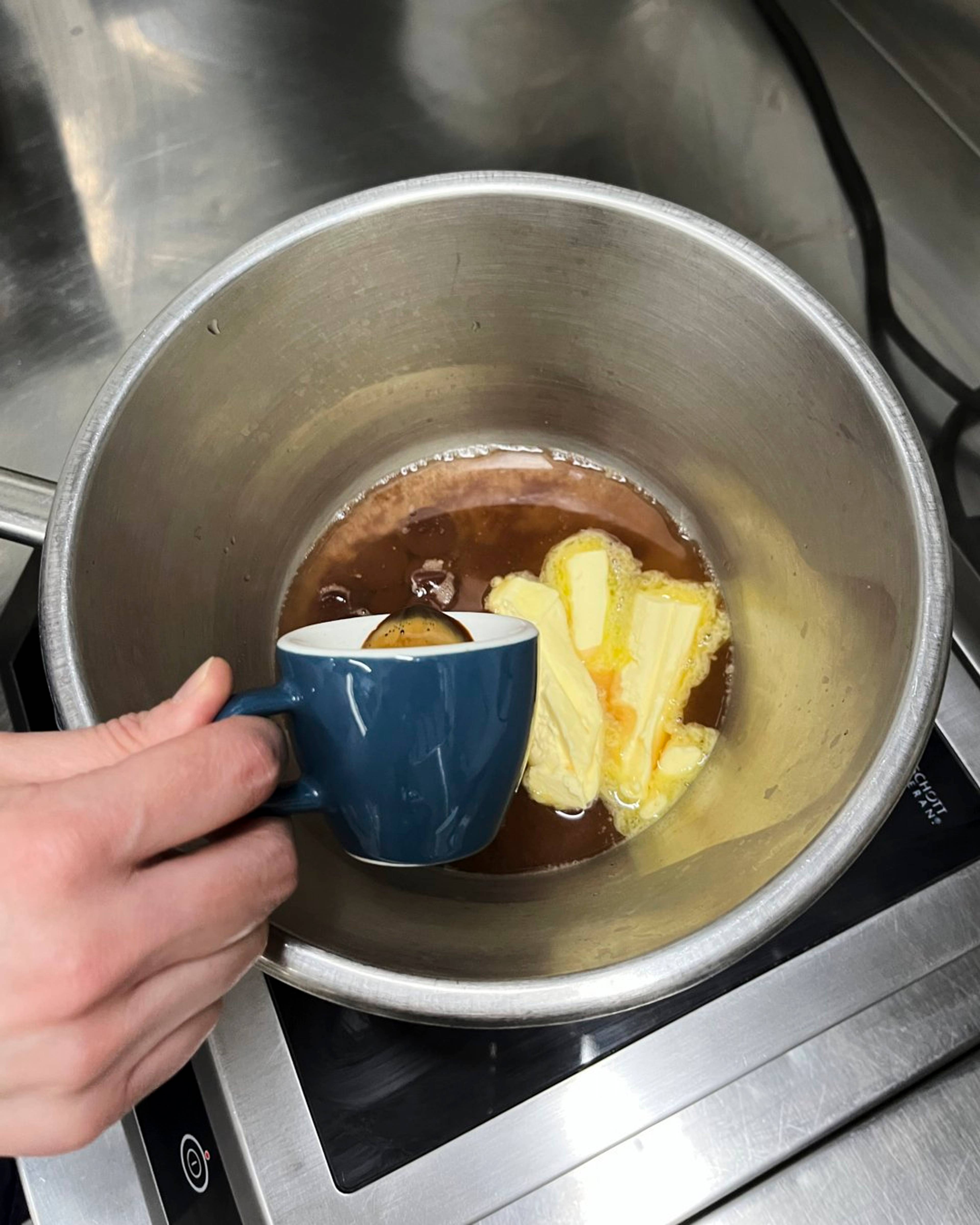 espresso being poured in with the chocolate and butter