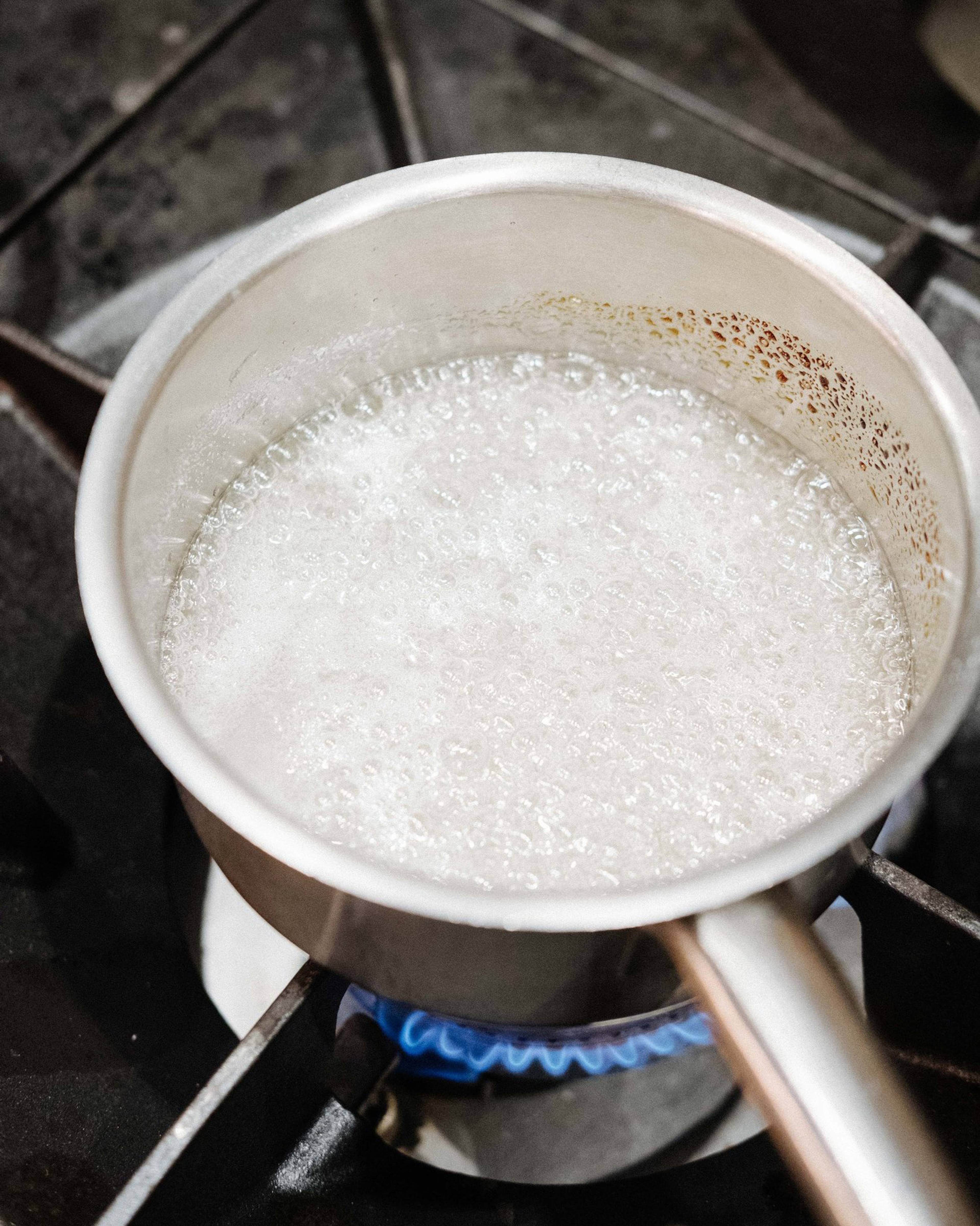 Dissolving the sugar in boiling water