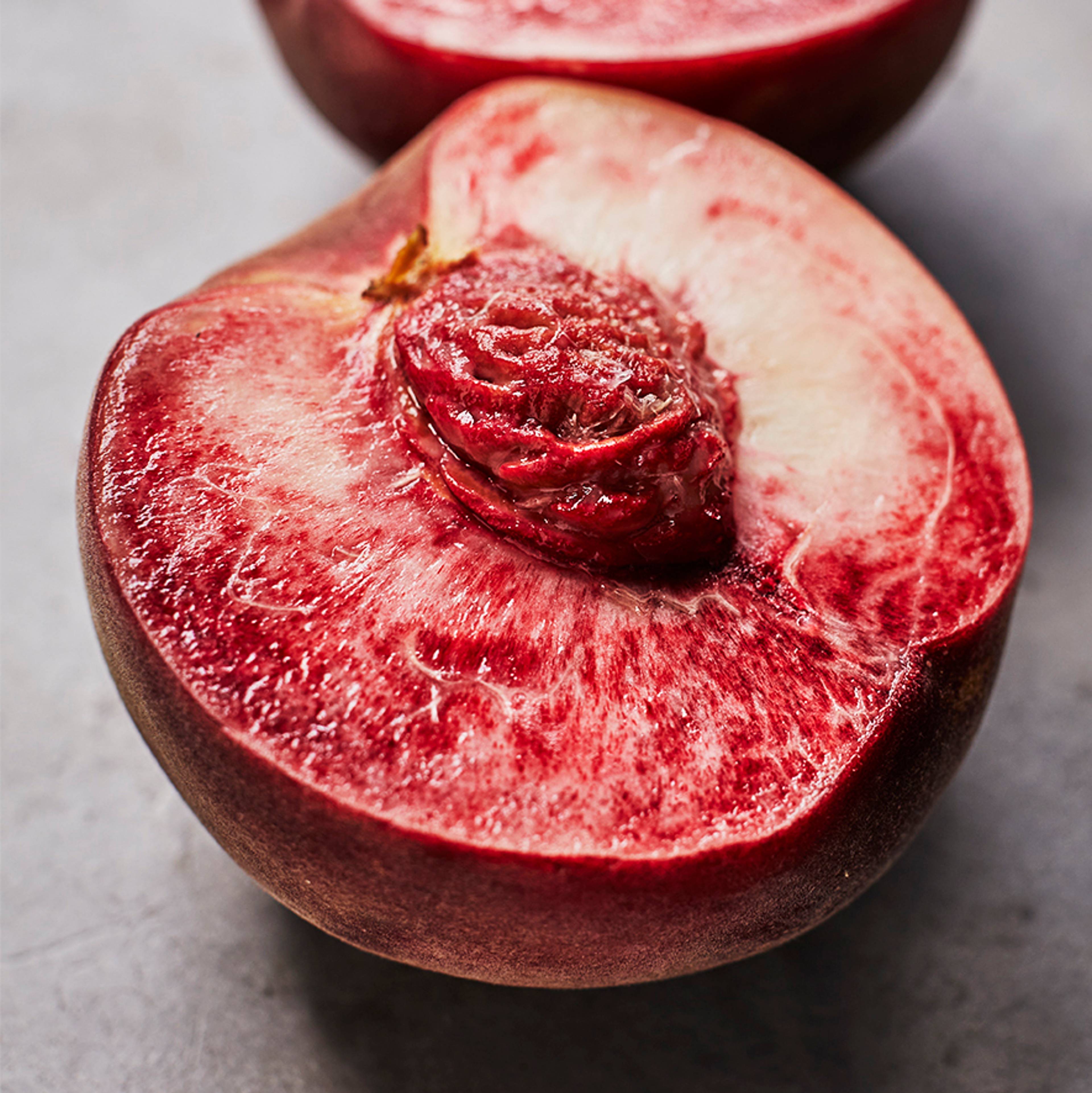 Close up of a peach cut in half