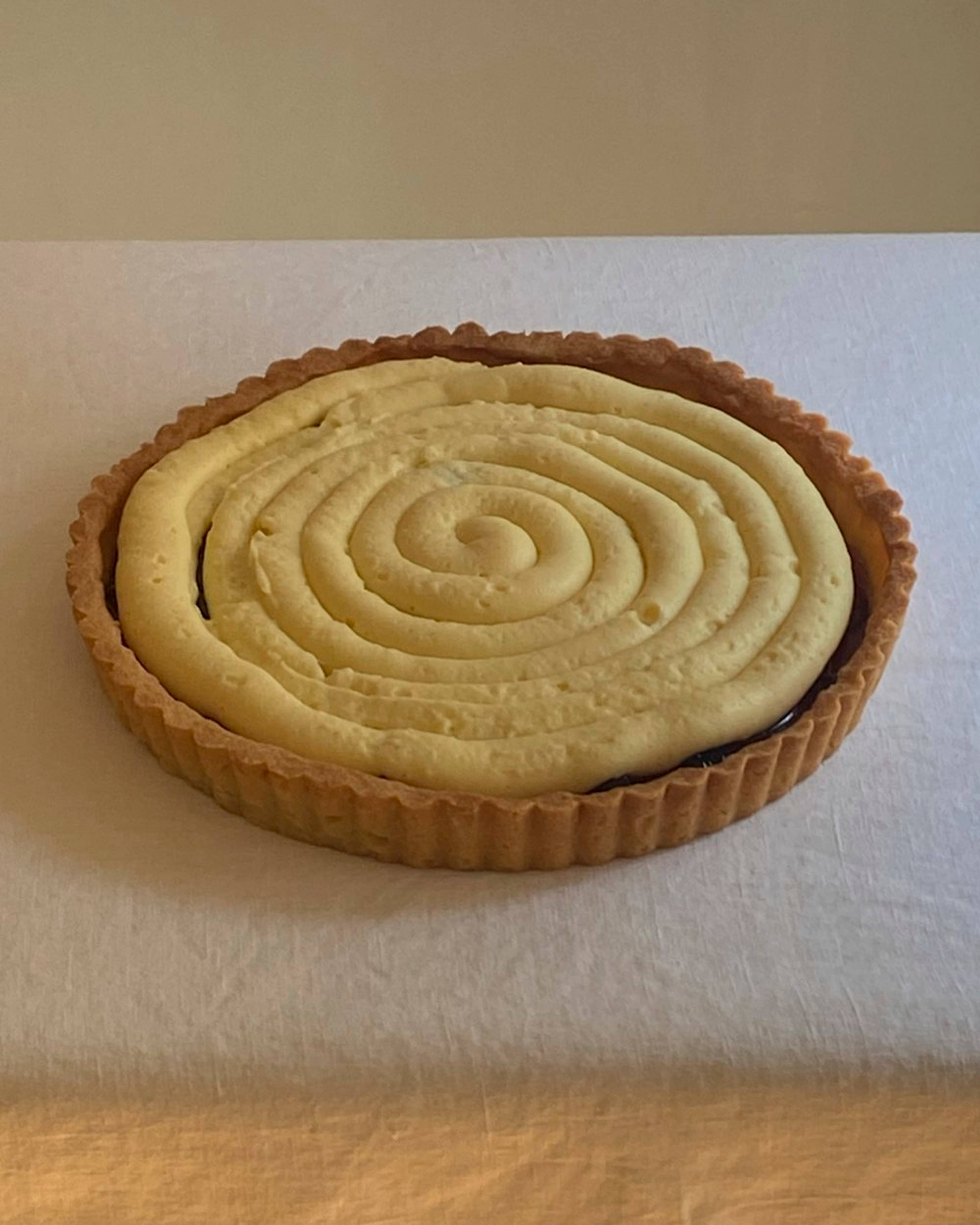 Layer of pastry cream swirled onto the jam