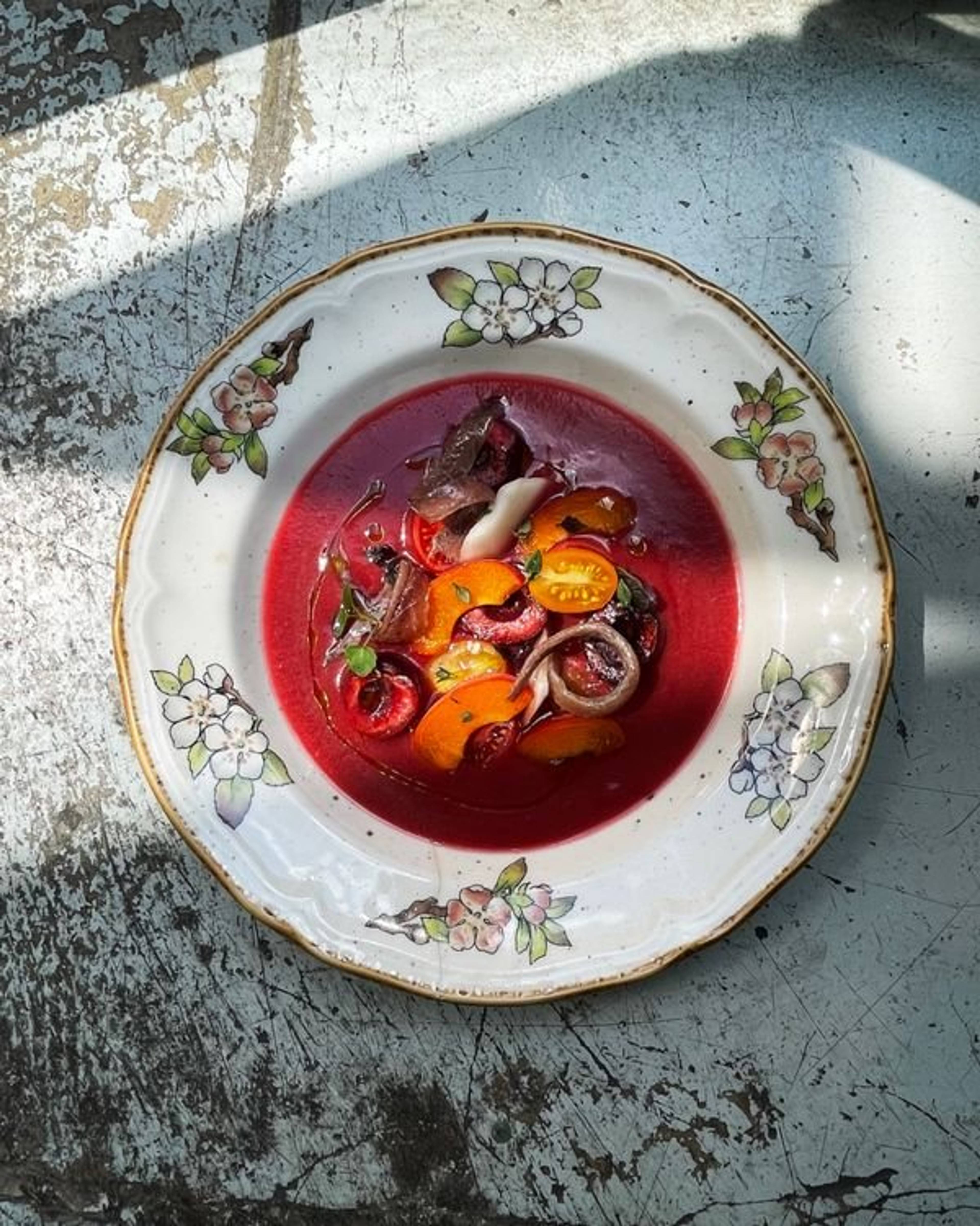 cherry salmorejo serves on vintage style china dish