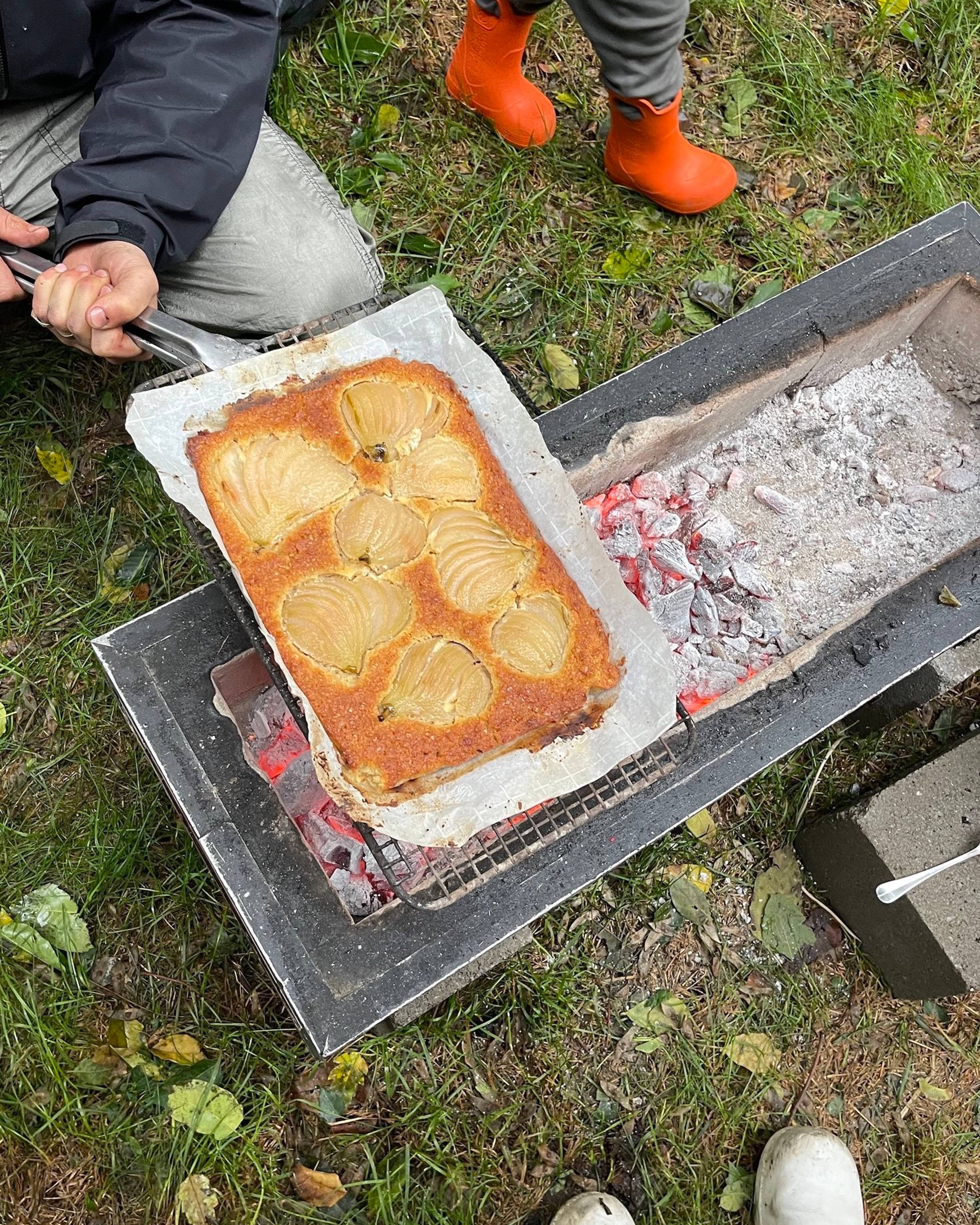 pear tart being cooked over open grill outside
