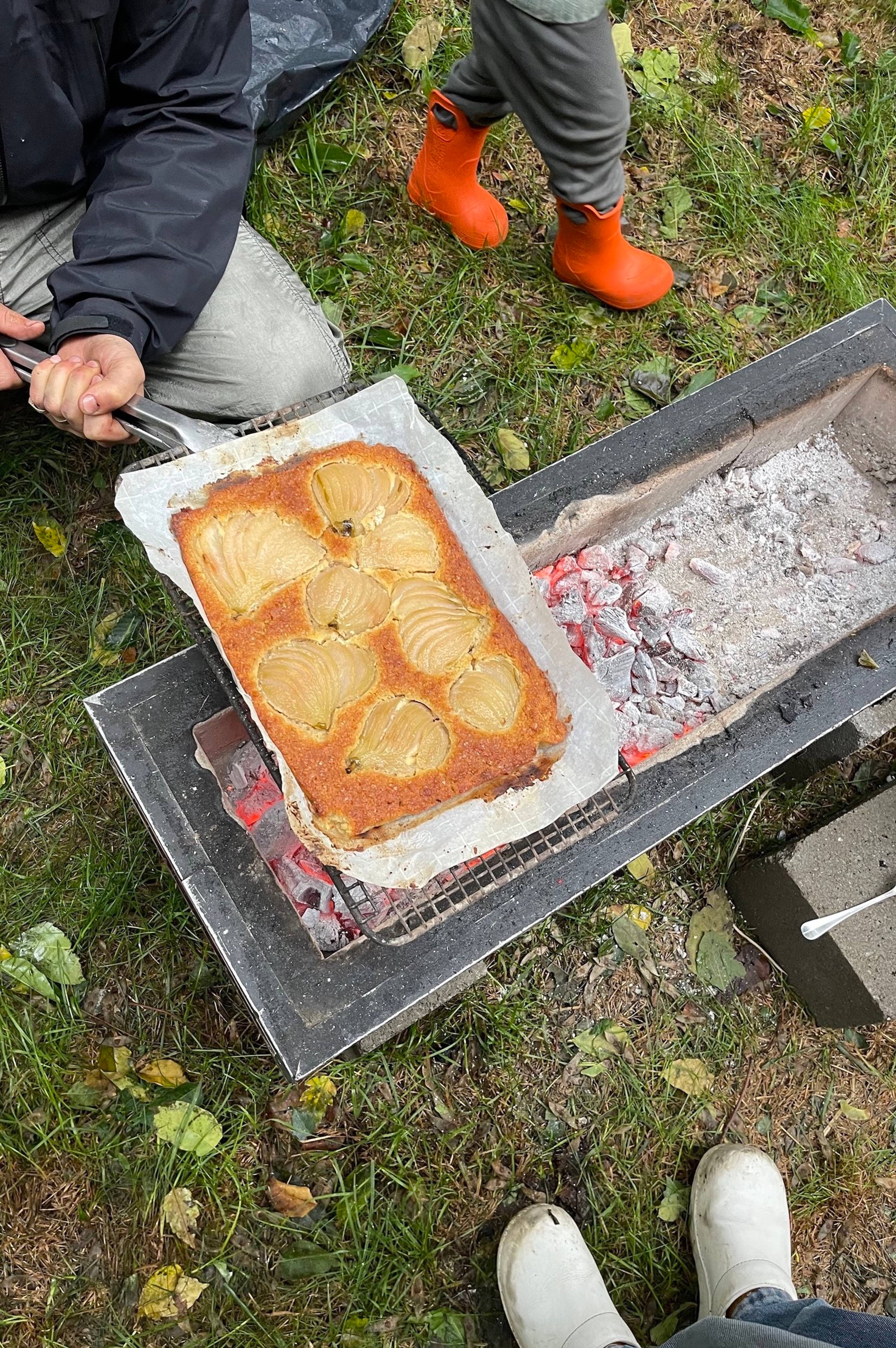 pear tart being cooked over open grill outside