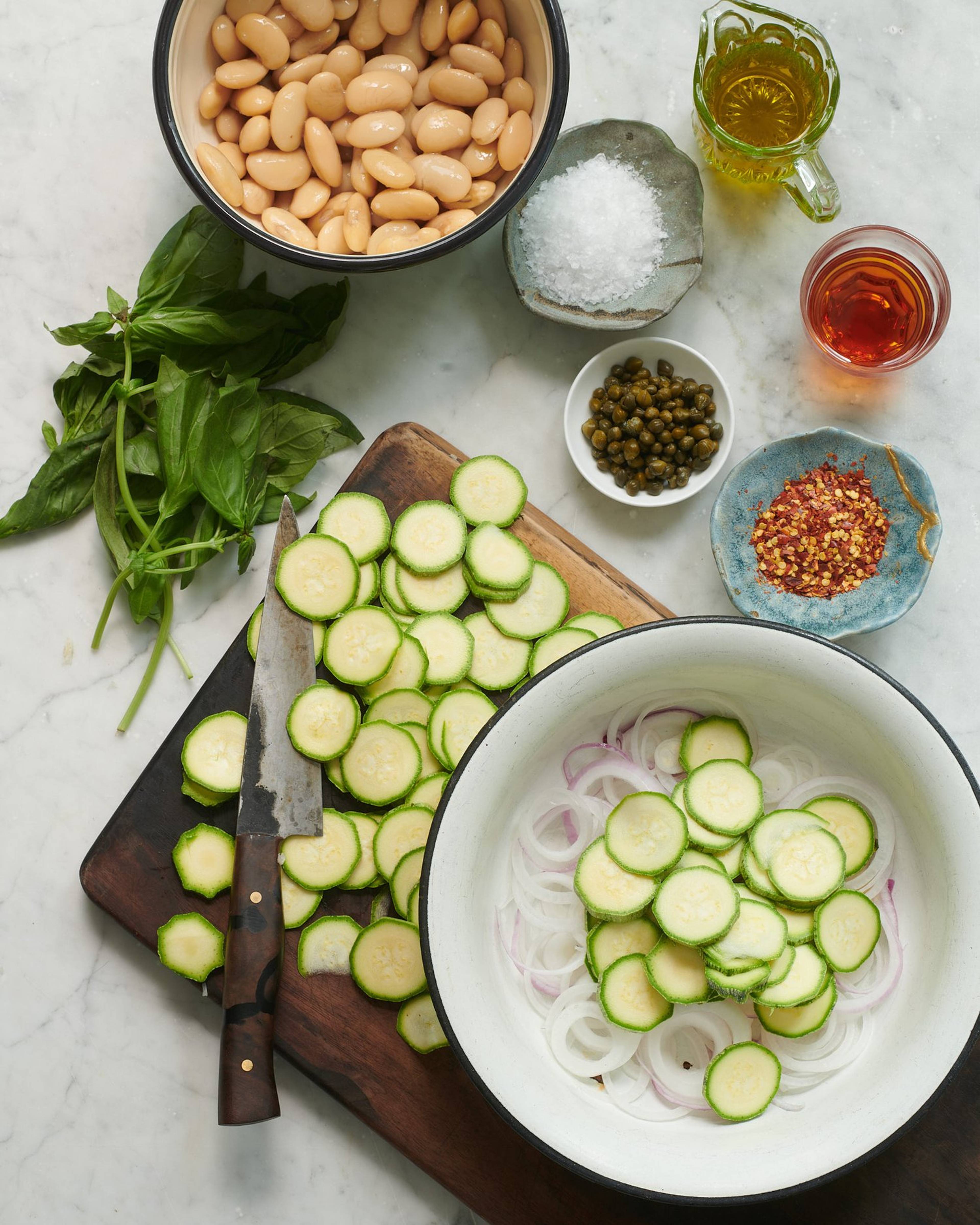 Sliced tropea onions and courgettes