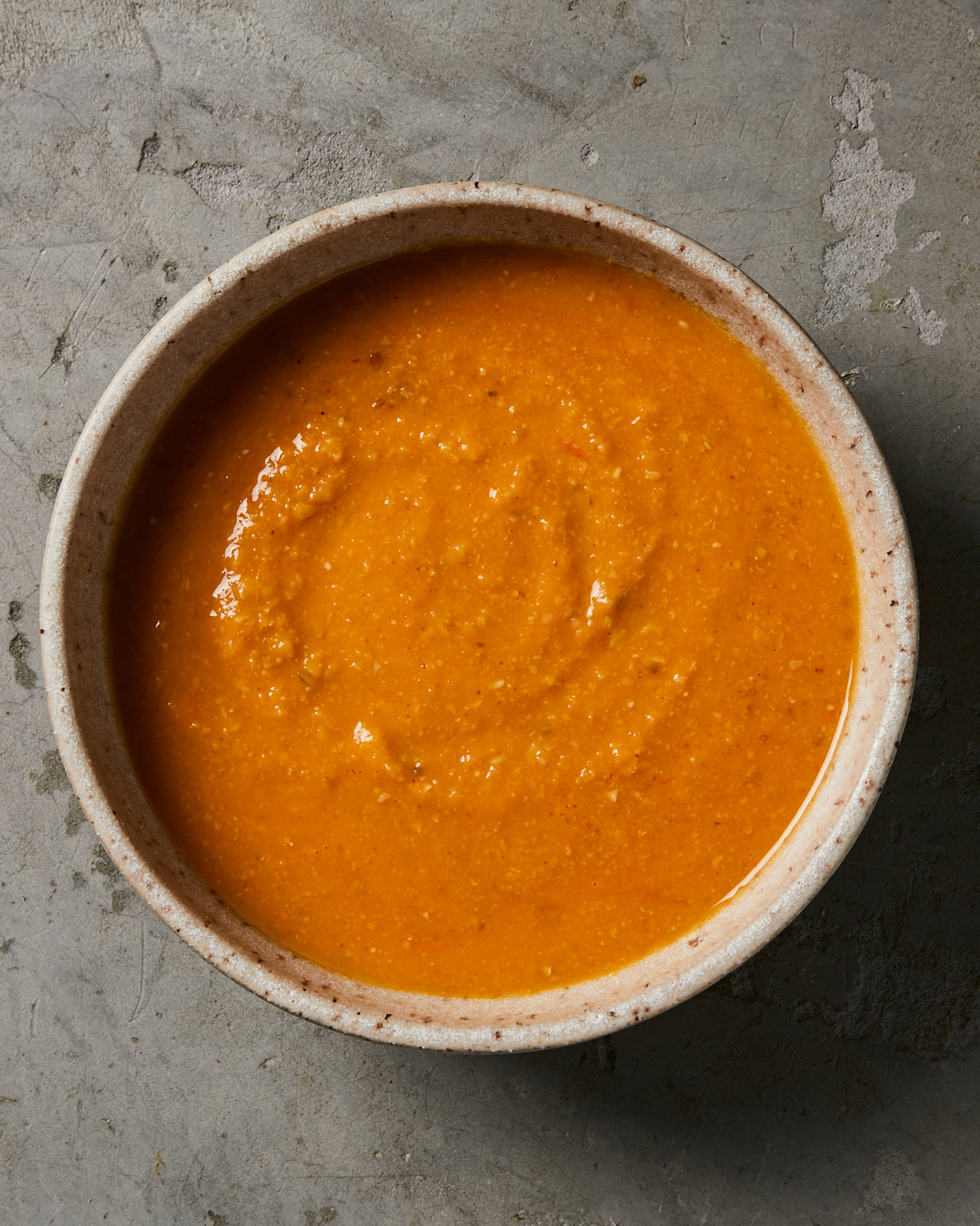 red pepper and chickpea soup in a bowl