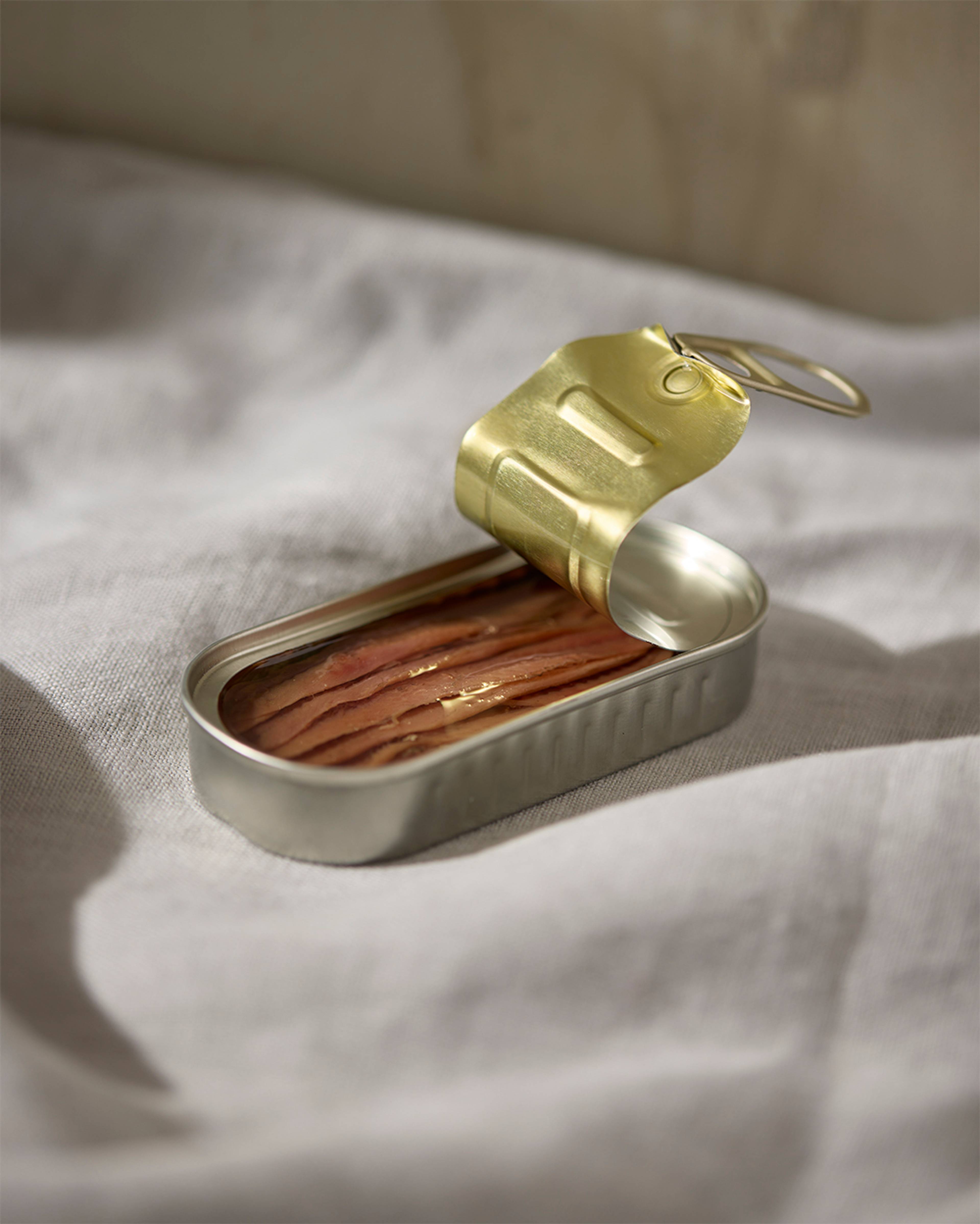 open tin of olasagasti anchovies