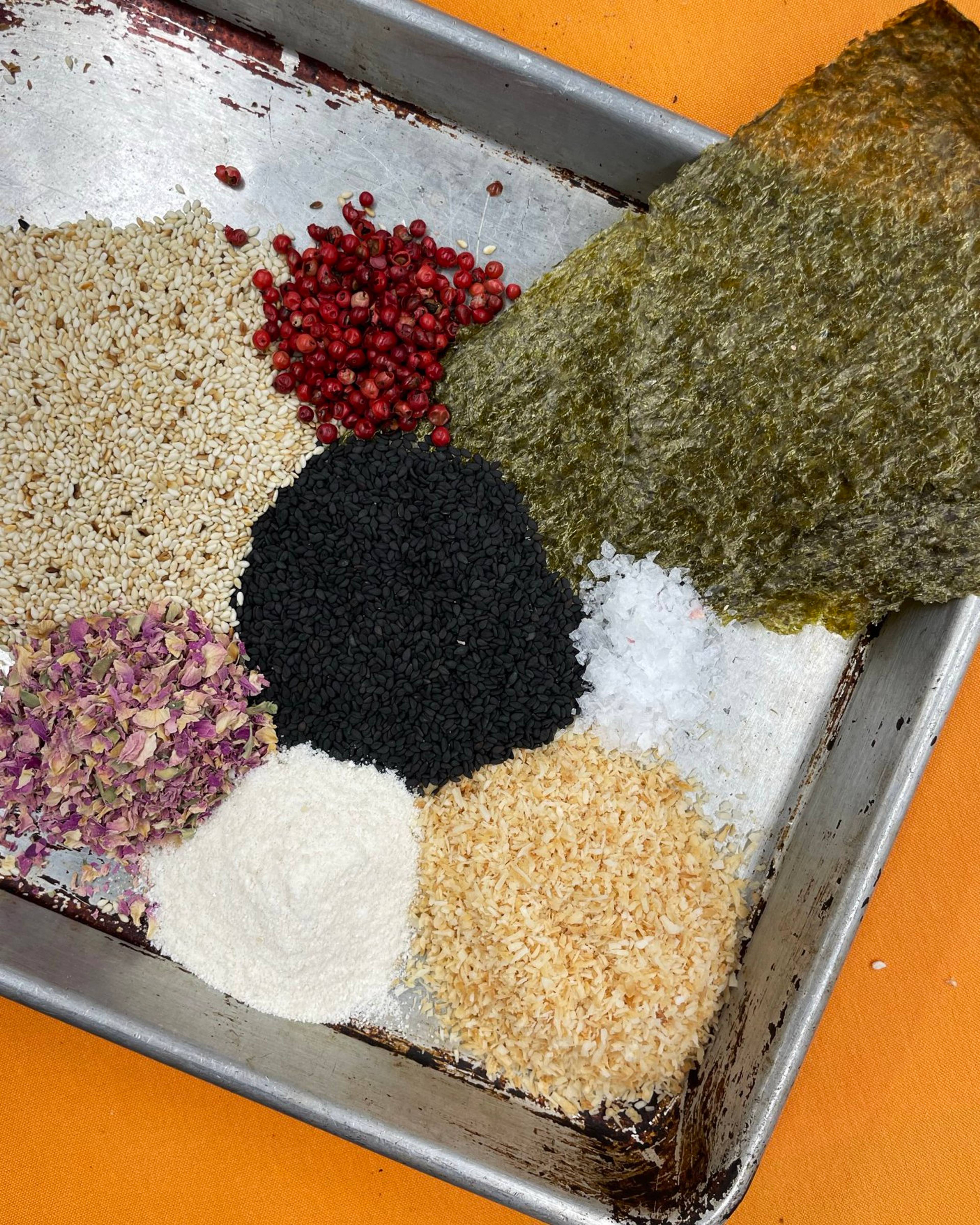 spices in piles on a baking tray