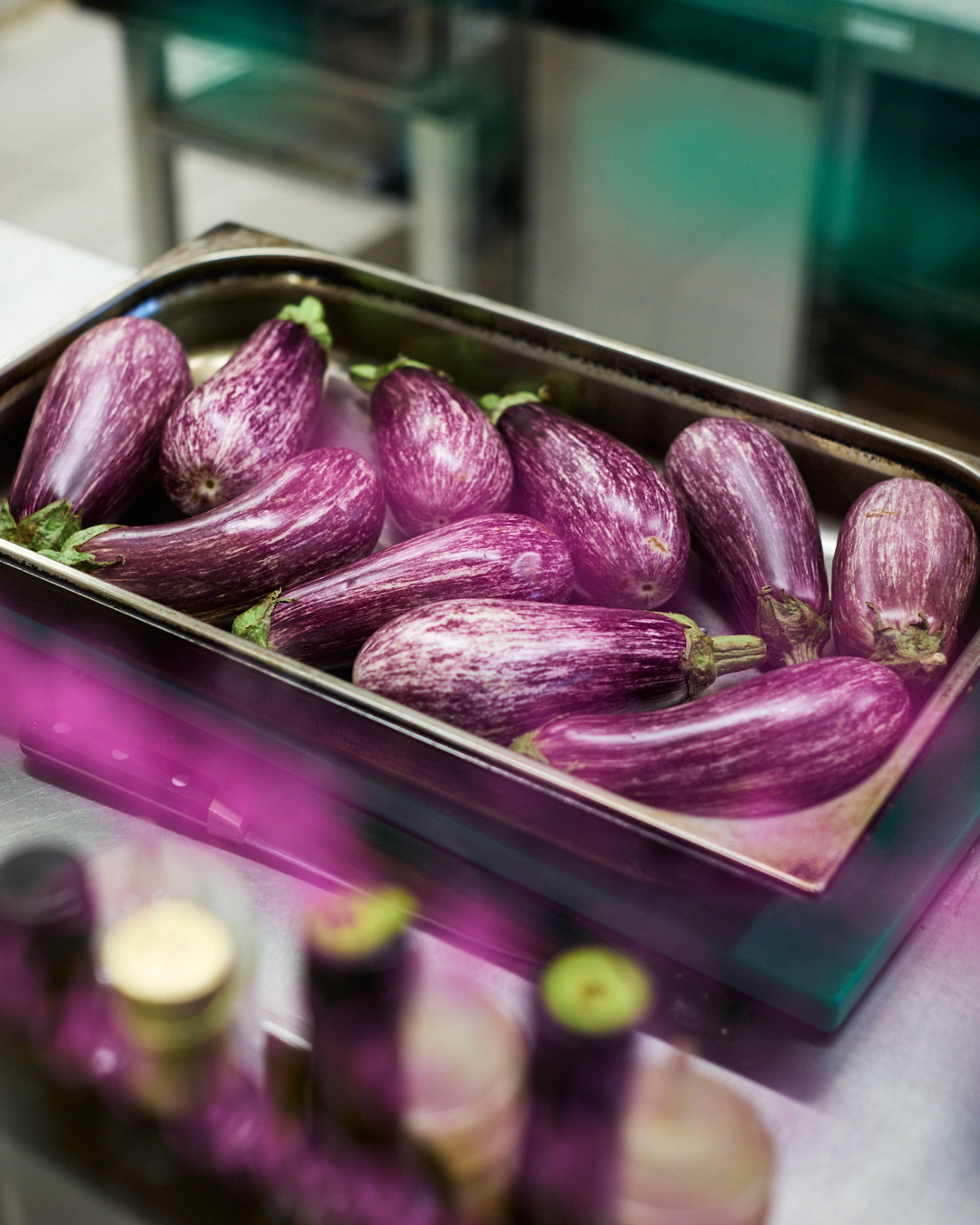 graffiti aubergines in a tray