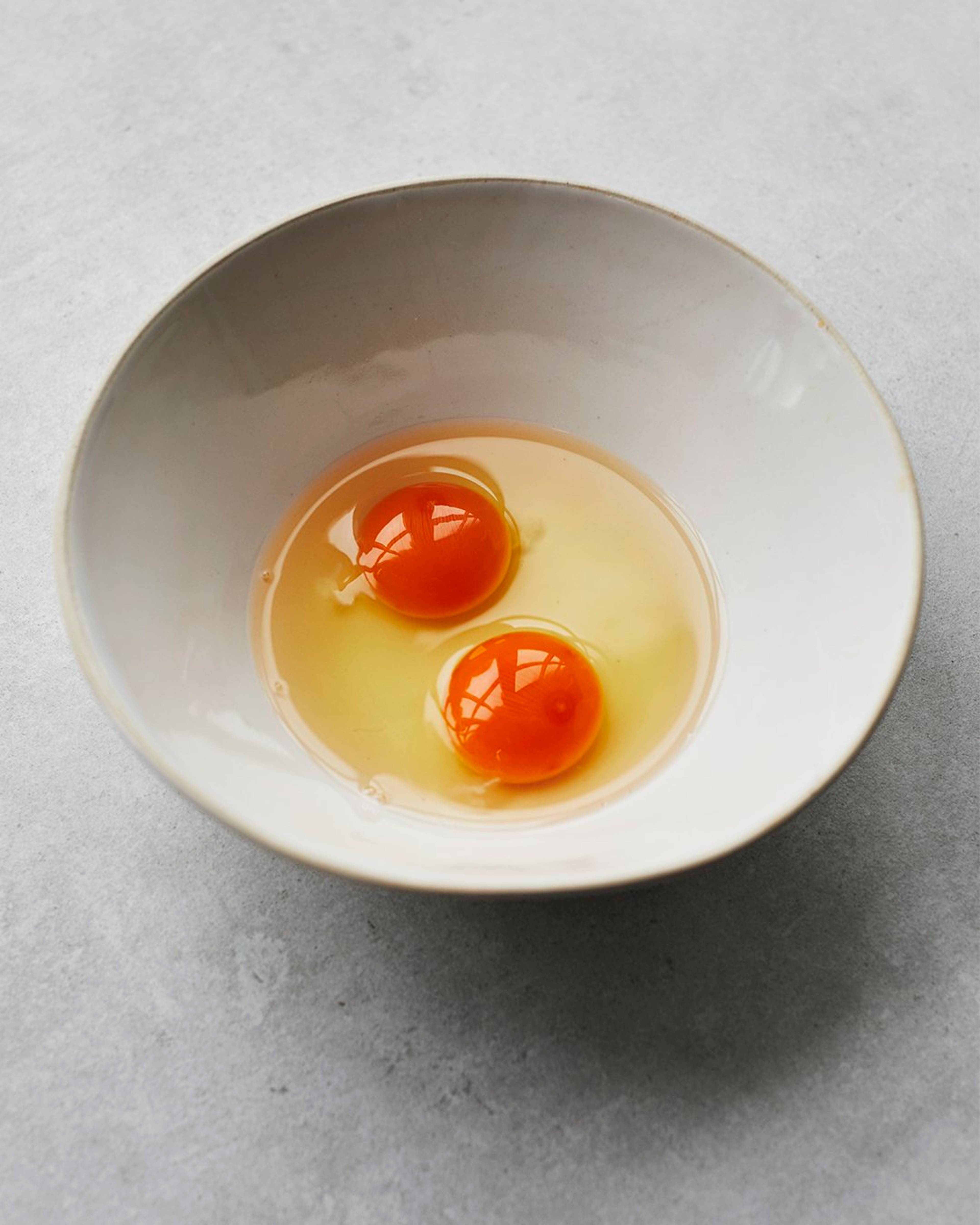 two eggs cracked in a bowl