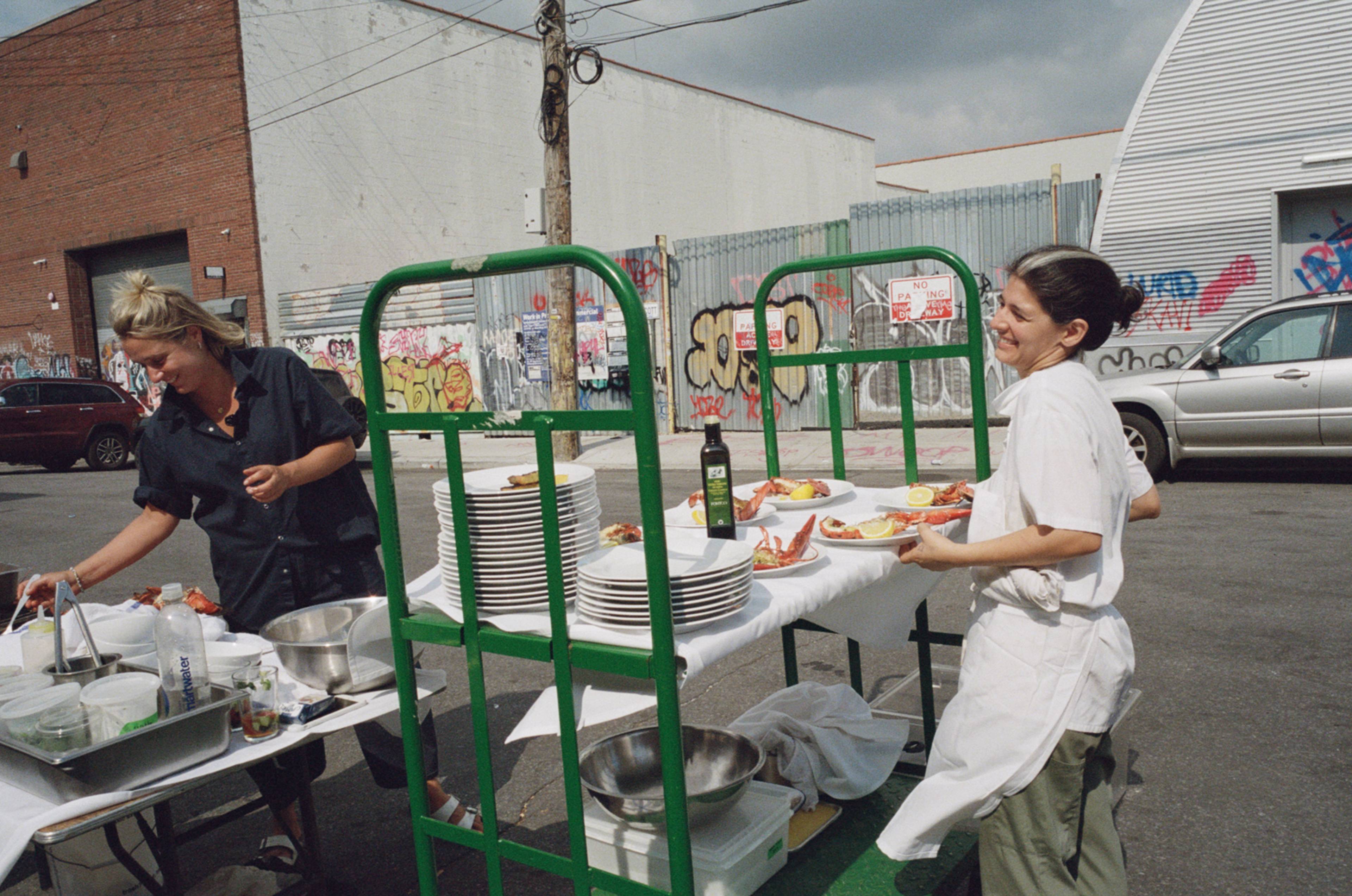 jess and angeles cooking at the natoora warehouse dinner