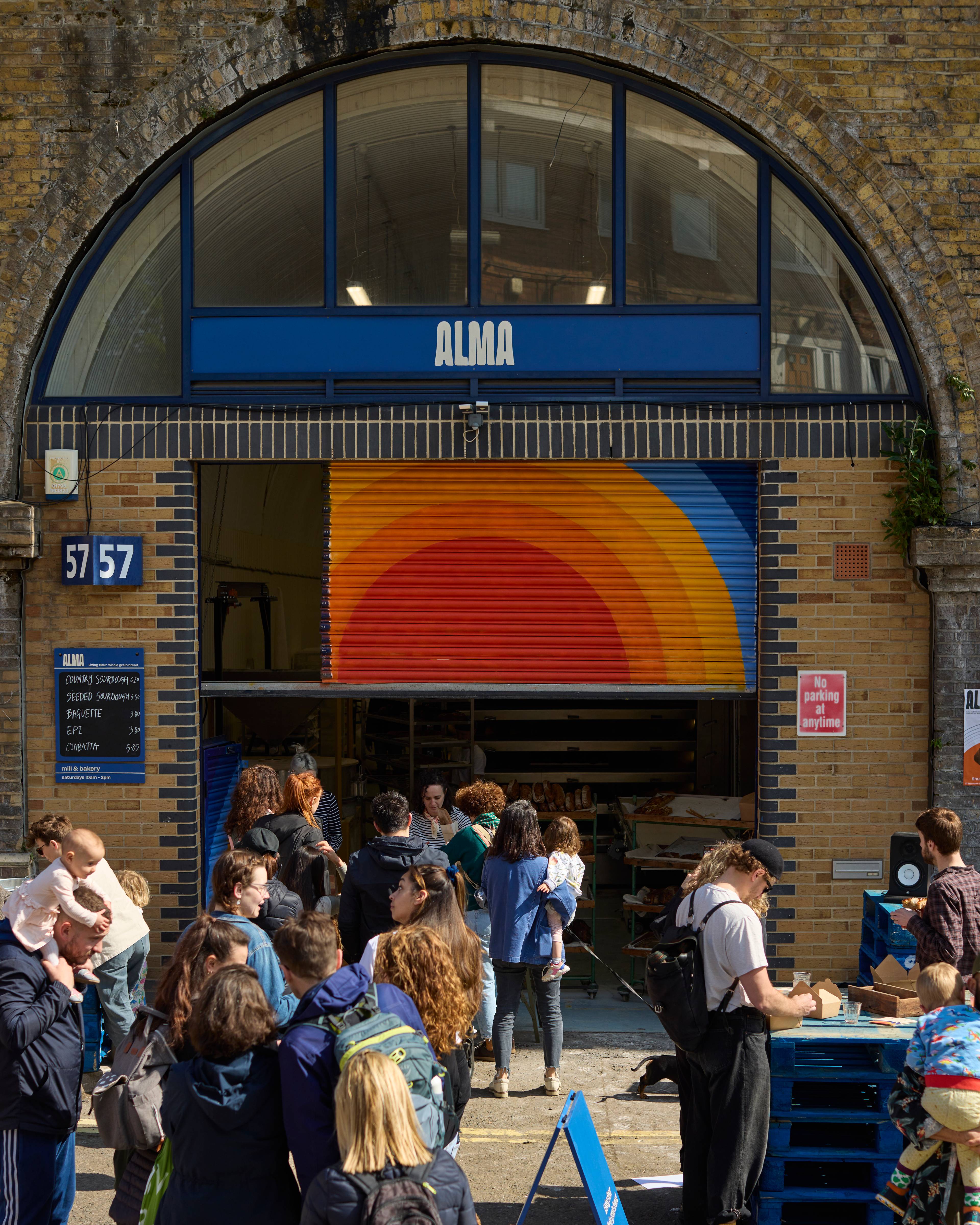People queueing outside Alma bakery on launch day