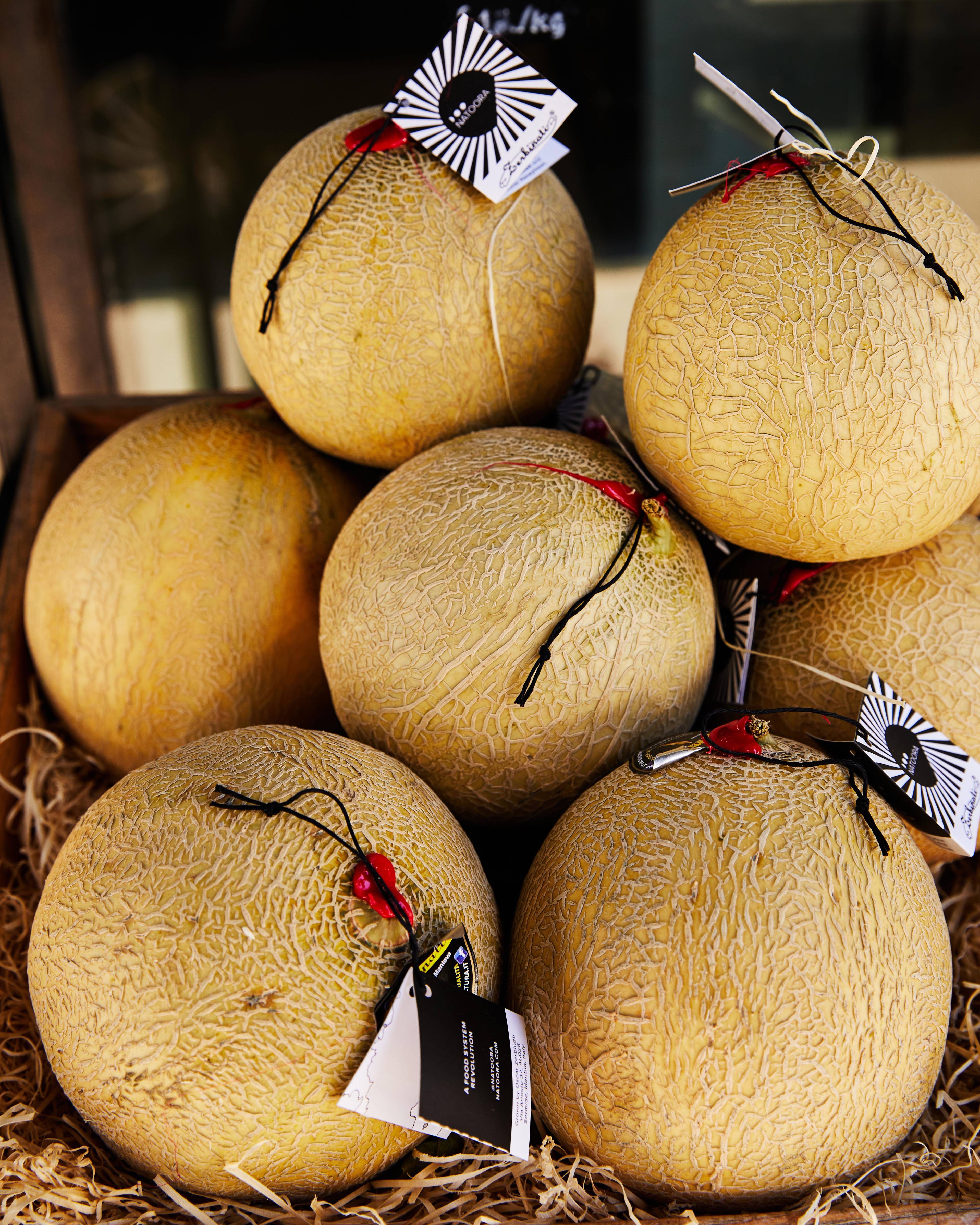 sunsweet melons staked on top of eachother
