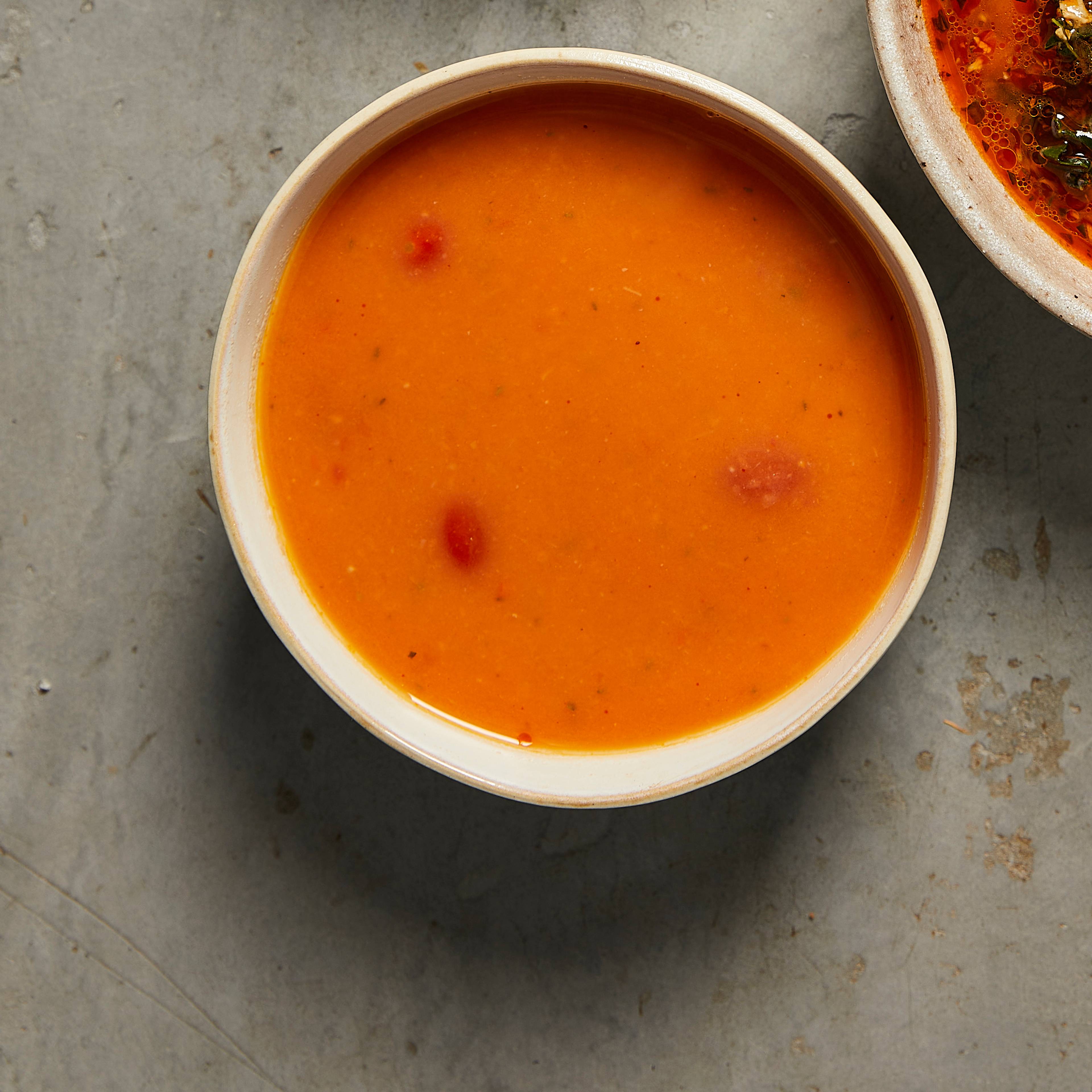 Datterini tomato and white bean soup in a bowl