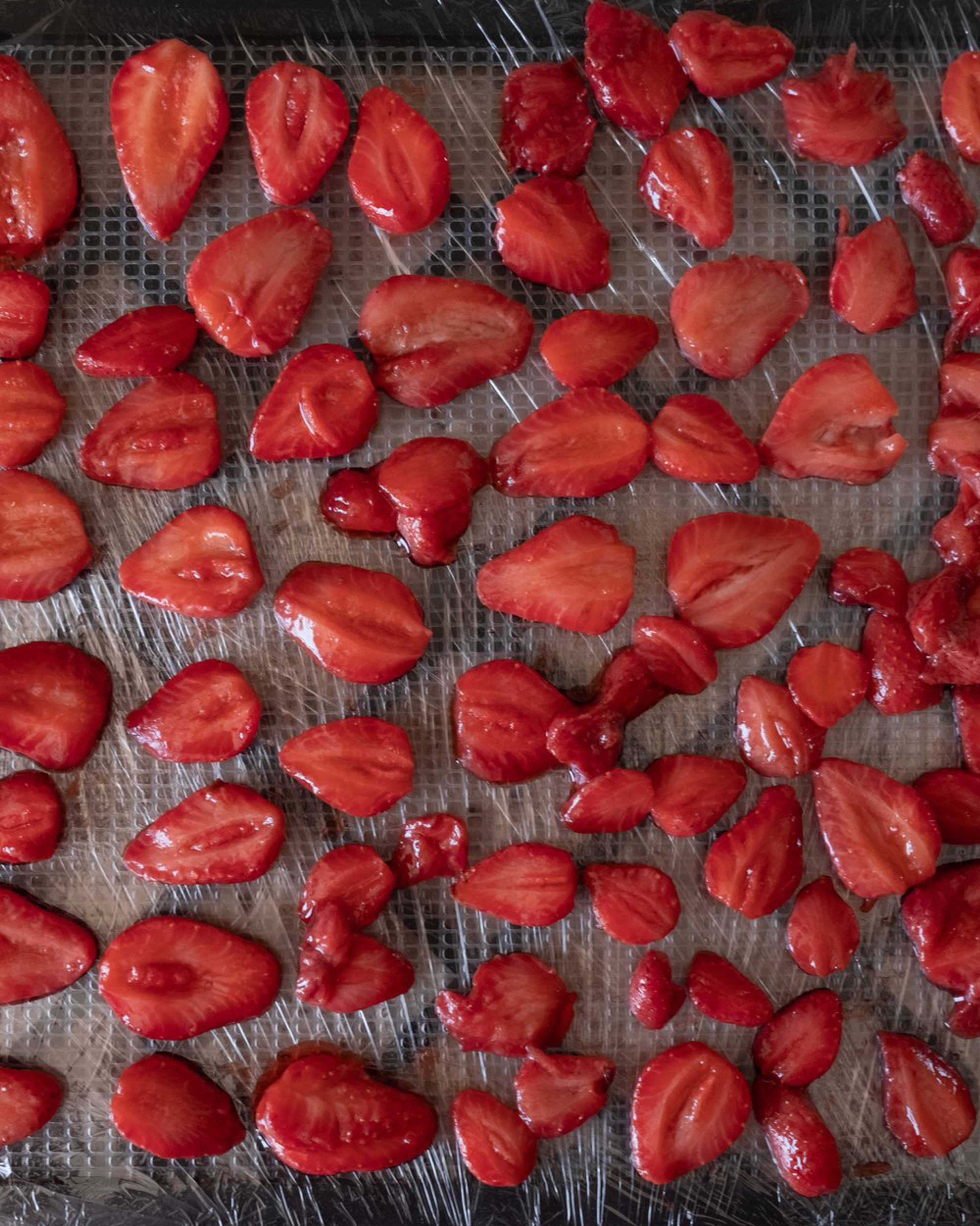 Stawberries cut in half after simmering