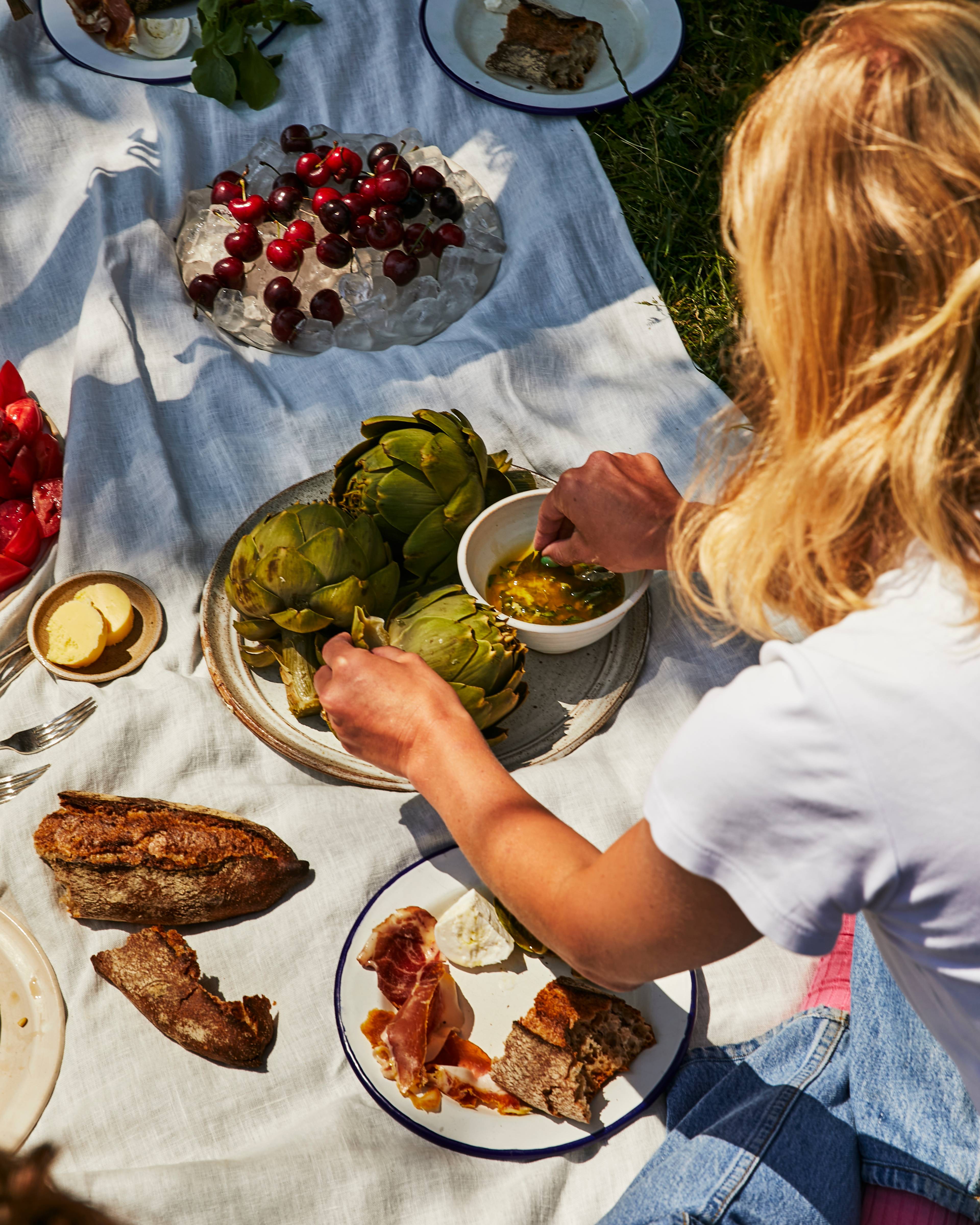 Dipping artichokes at a picnic