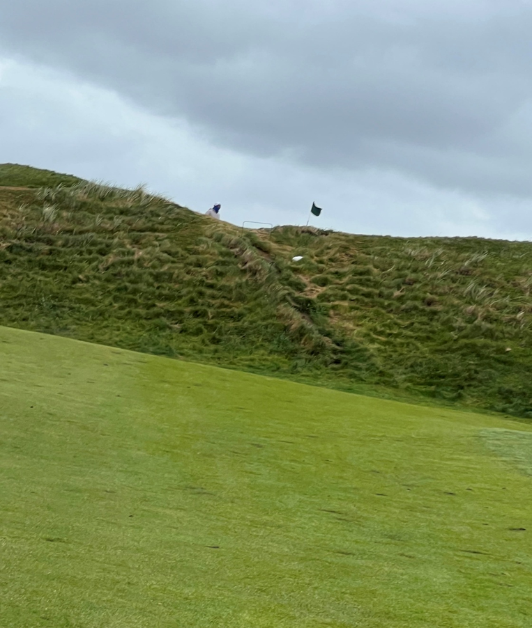 The forecaddie atop the Dune on #4 that you must carry on your 2nd shot—he doubles as a traffic cop for holes 5 & 18—other side of the dune