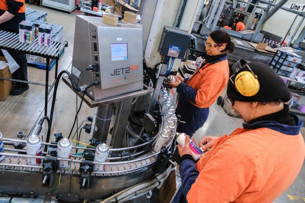 team members are working on a manufacturing line team members are working on a manufacturing line
