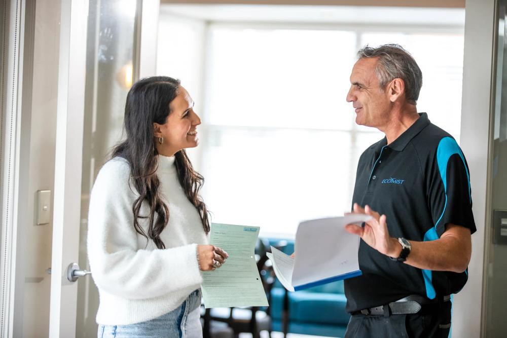 a man is pushing a forklift in a warehouse