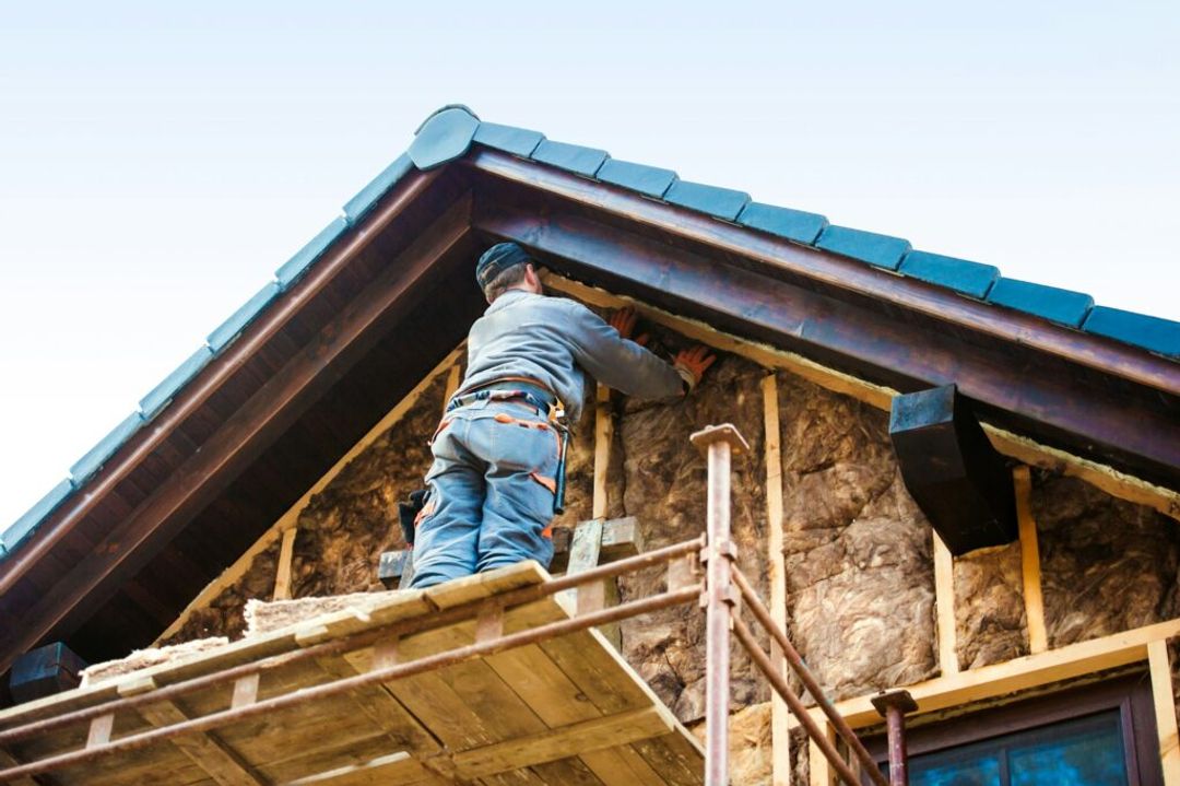 Pink fiberglass batt insulation installed in a typical American home wall cavity