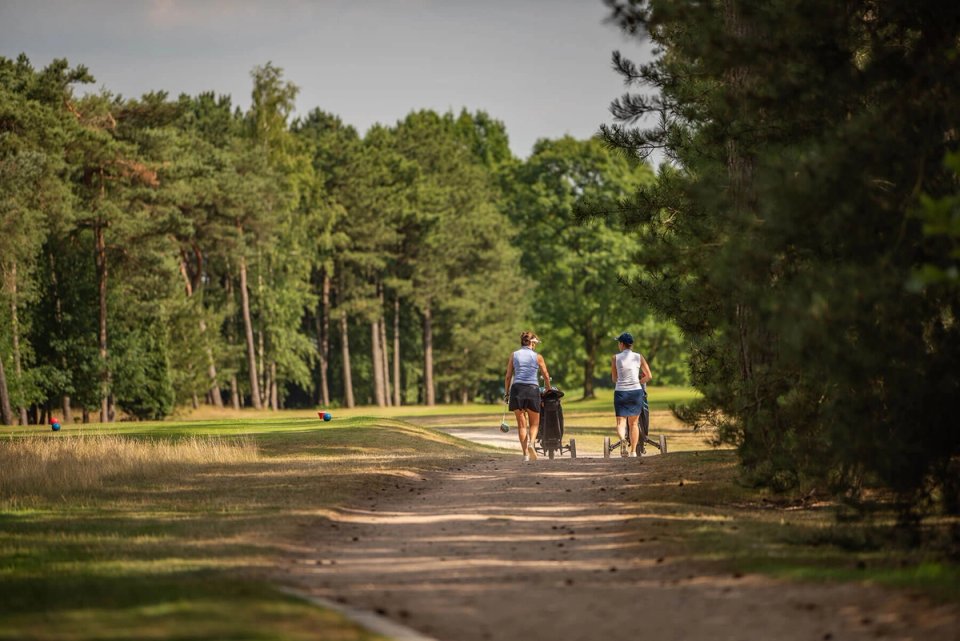 Golfers walking the course