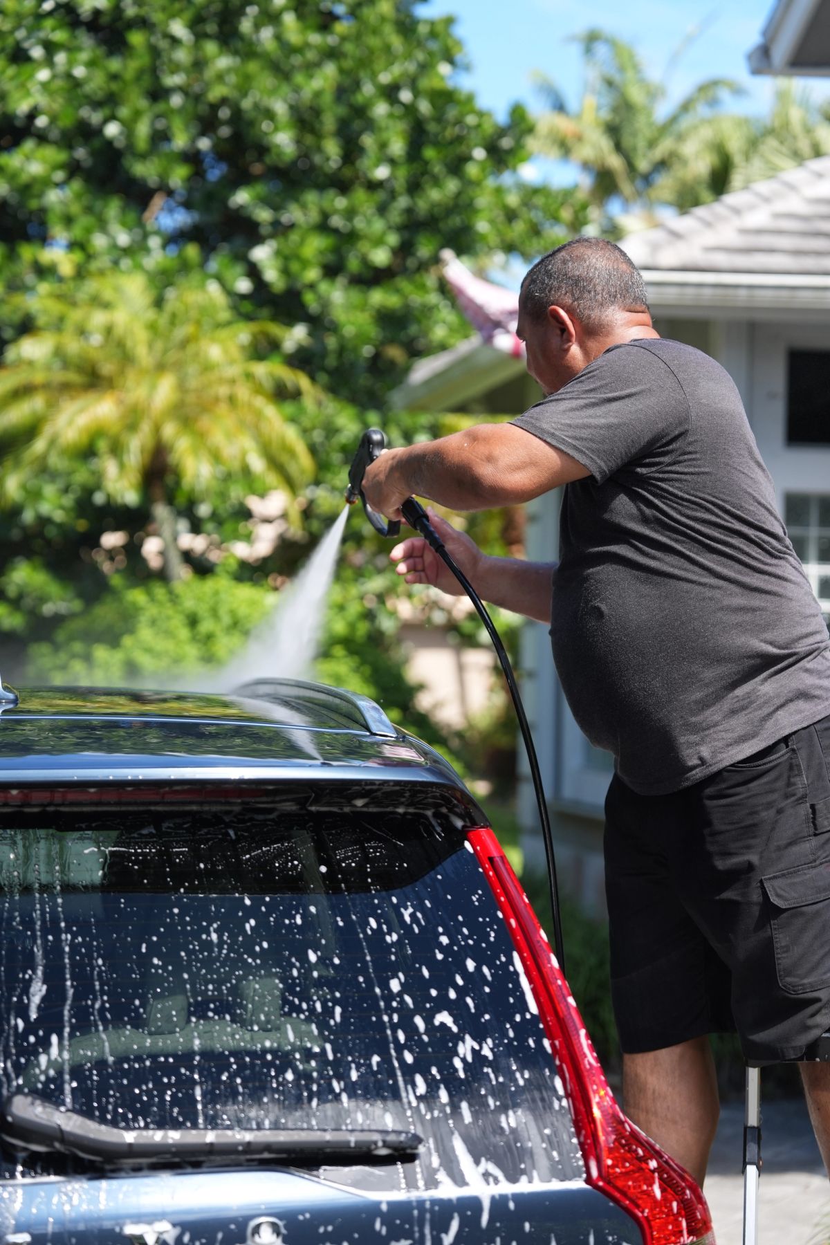 Worker washing car
