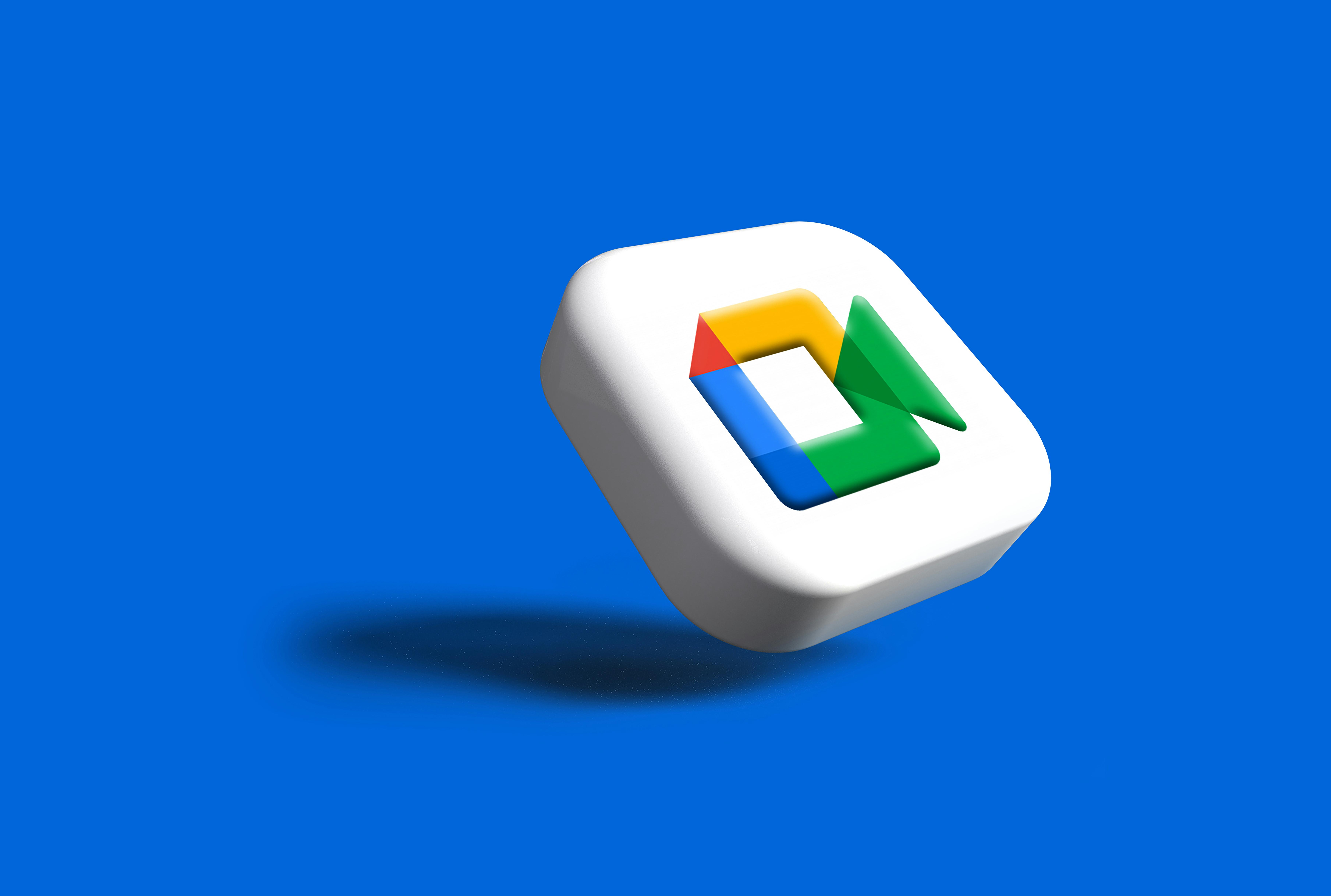 A white 3D pill featuring the Google Meet logo.