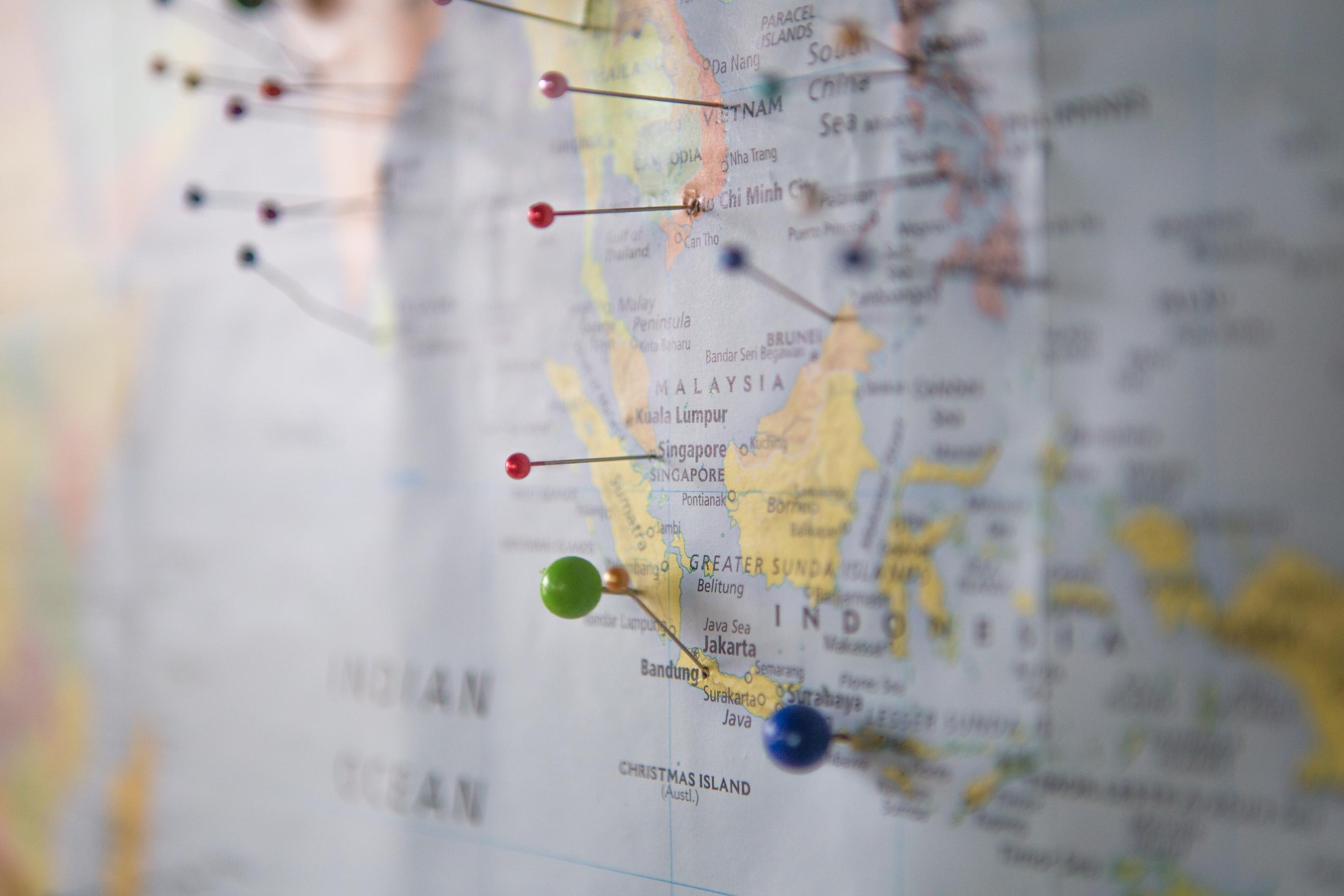 A map with multi-coloured pins marking locations.