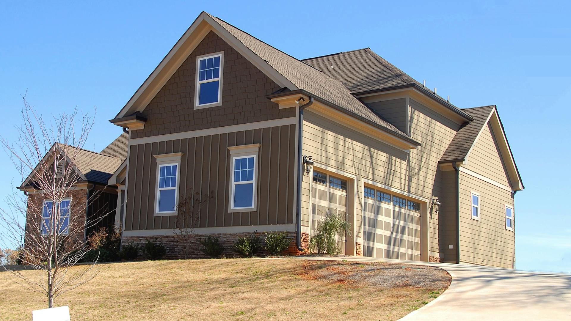 Brown and Beige Wooden House Under Blue Sky