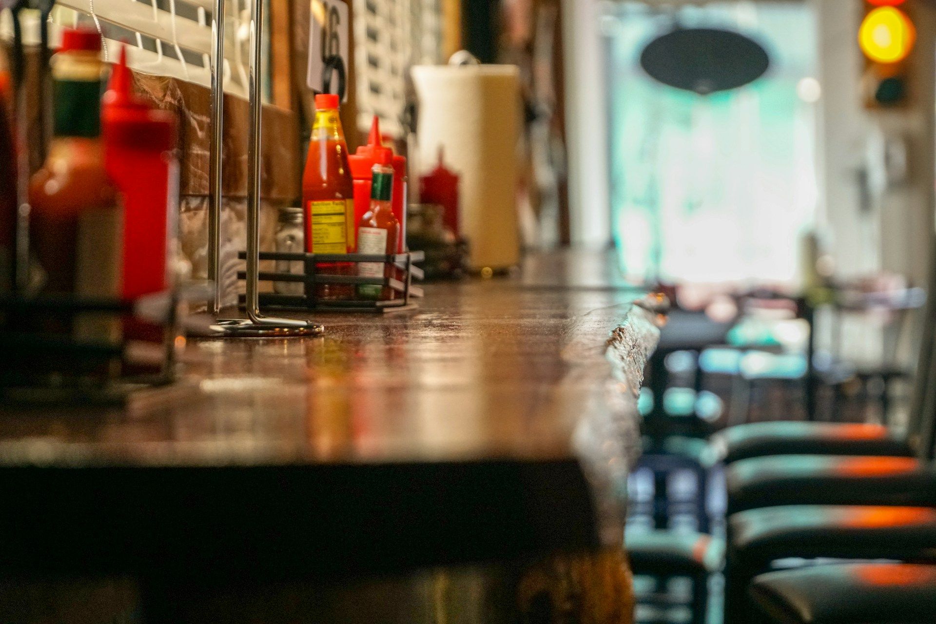 A clean rustic bar table top in a small town restaurant in Texas