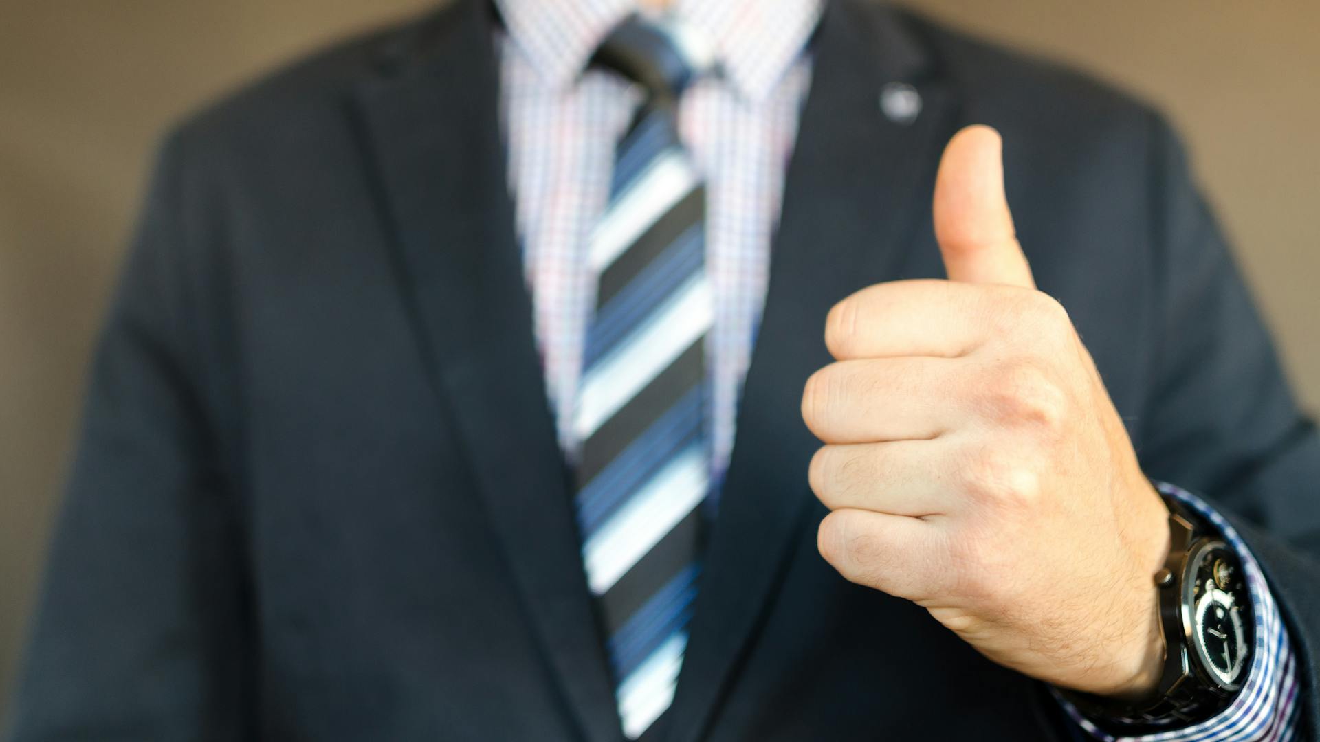 Man In Black Formal Suit Jacket Giving the Thumbs Up sign