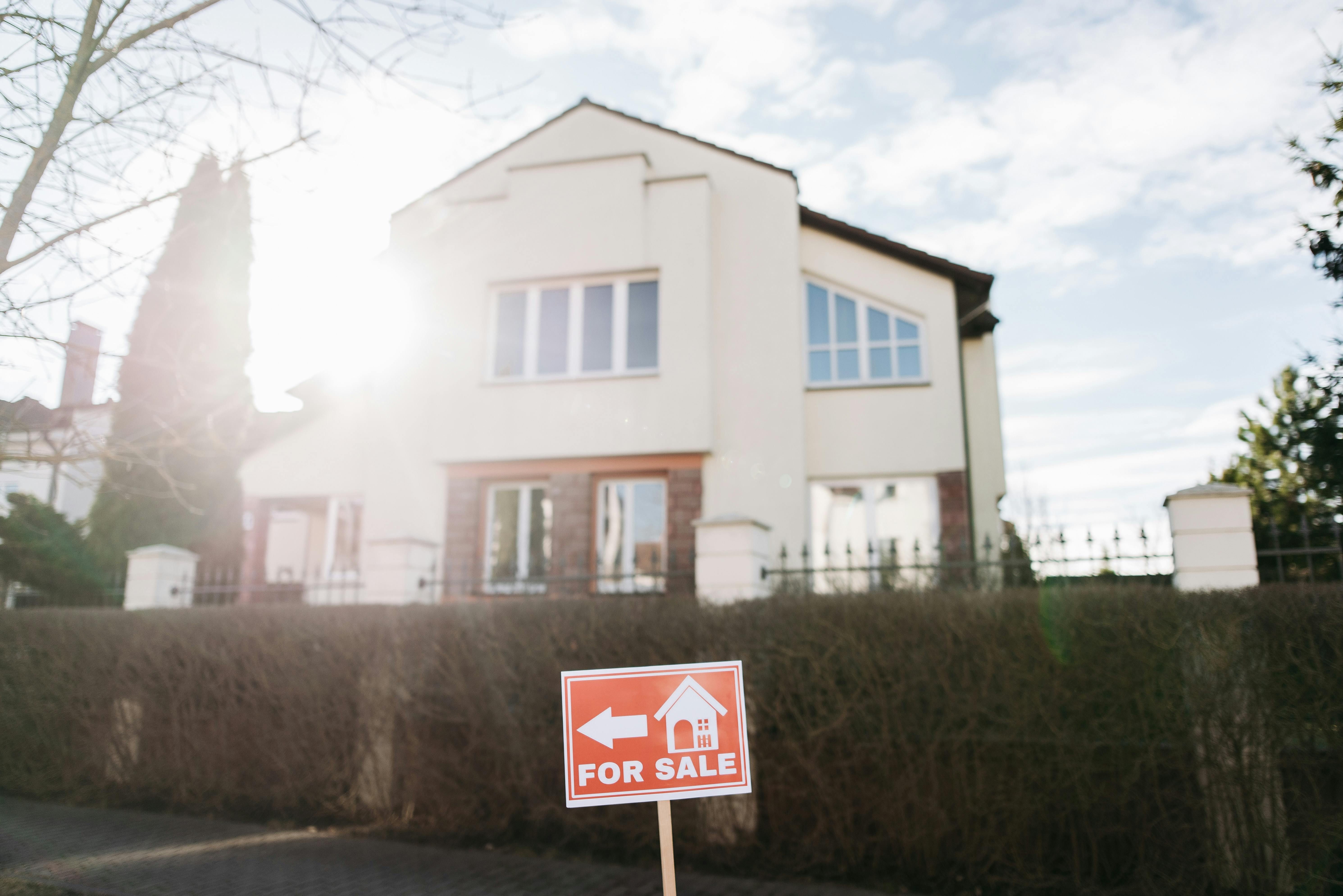 A For Sale Signage in Front of a House