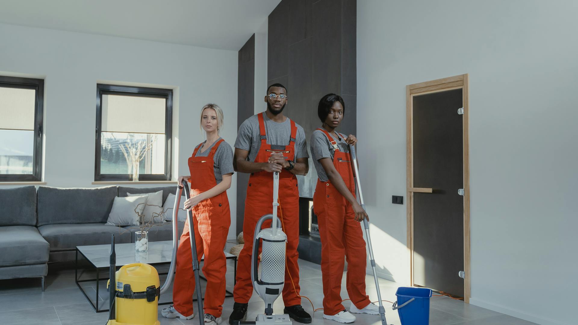 A team of professional Cleaners in Orange Uniform