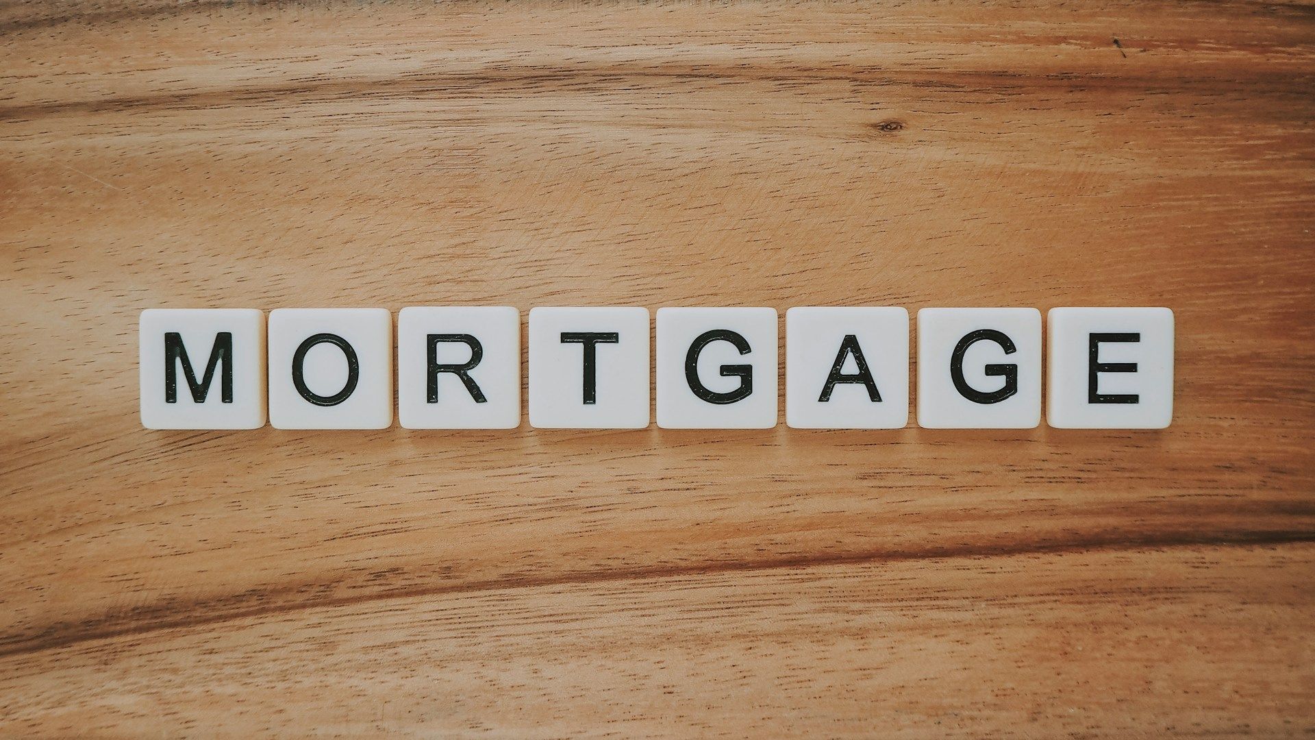 The word "Mortgage" spelled in letter tiles